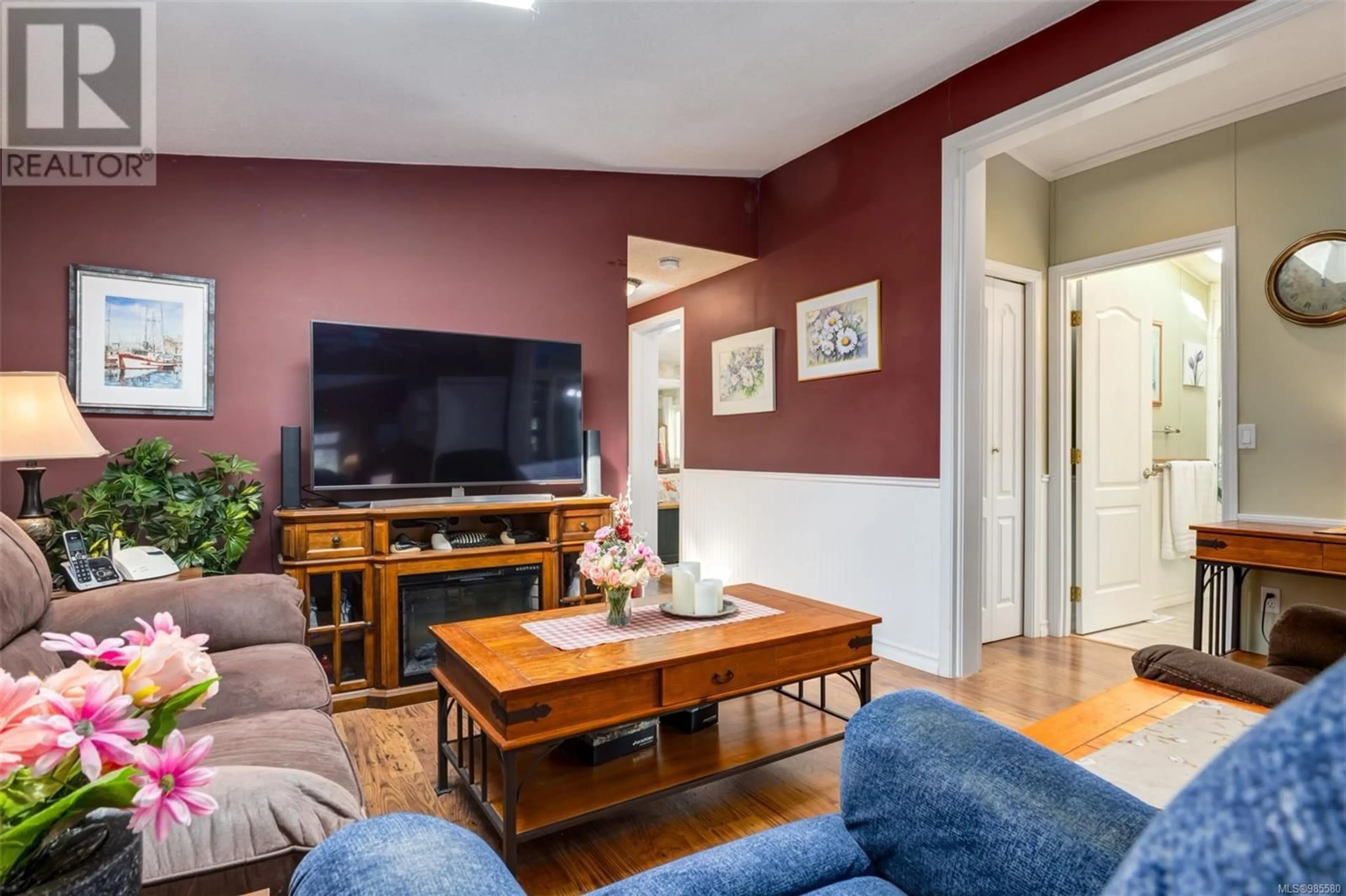 Living room with furniture, wood/laminate floor for 106 1075 Collier Cres, Nanaimo British Columbia V9R6K6