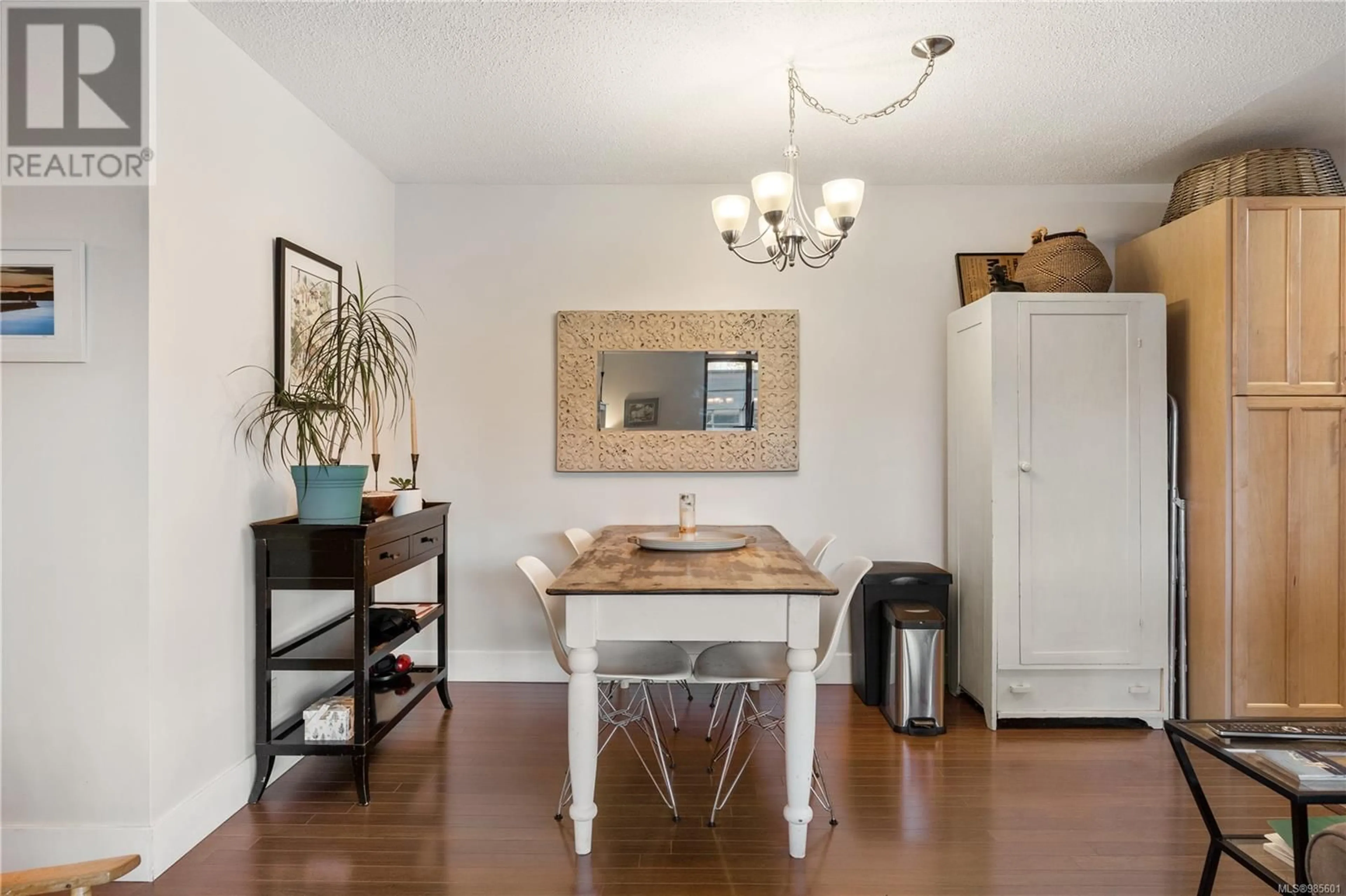 Dining room, wood/laminate floor for 303 1034 Johnson St, Victoria British Columbia V8V3N7