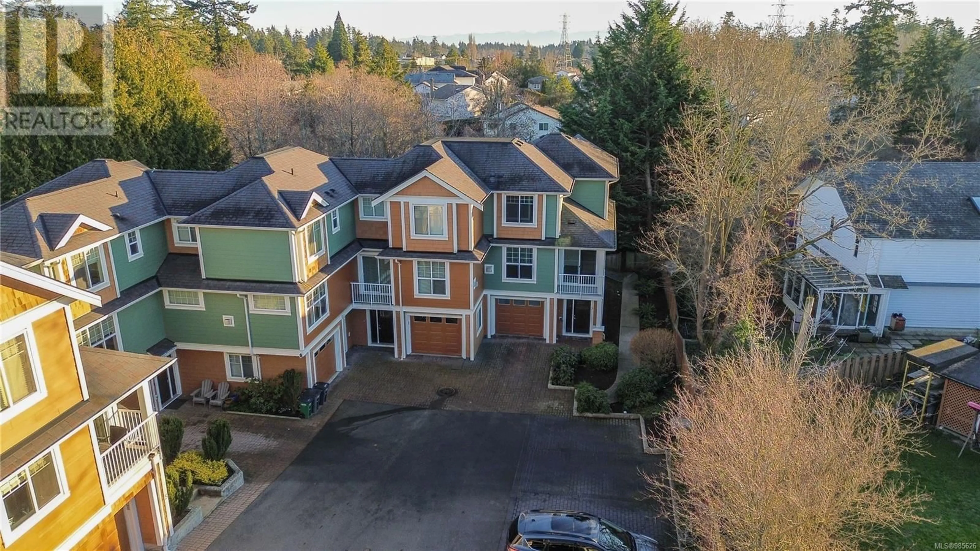 A pic from outside/outdoor area/front of a property/back of a property/a pic from drone, street for 9 4289 Wilkinson Rd, Saanich British Columbia V8Z5B2