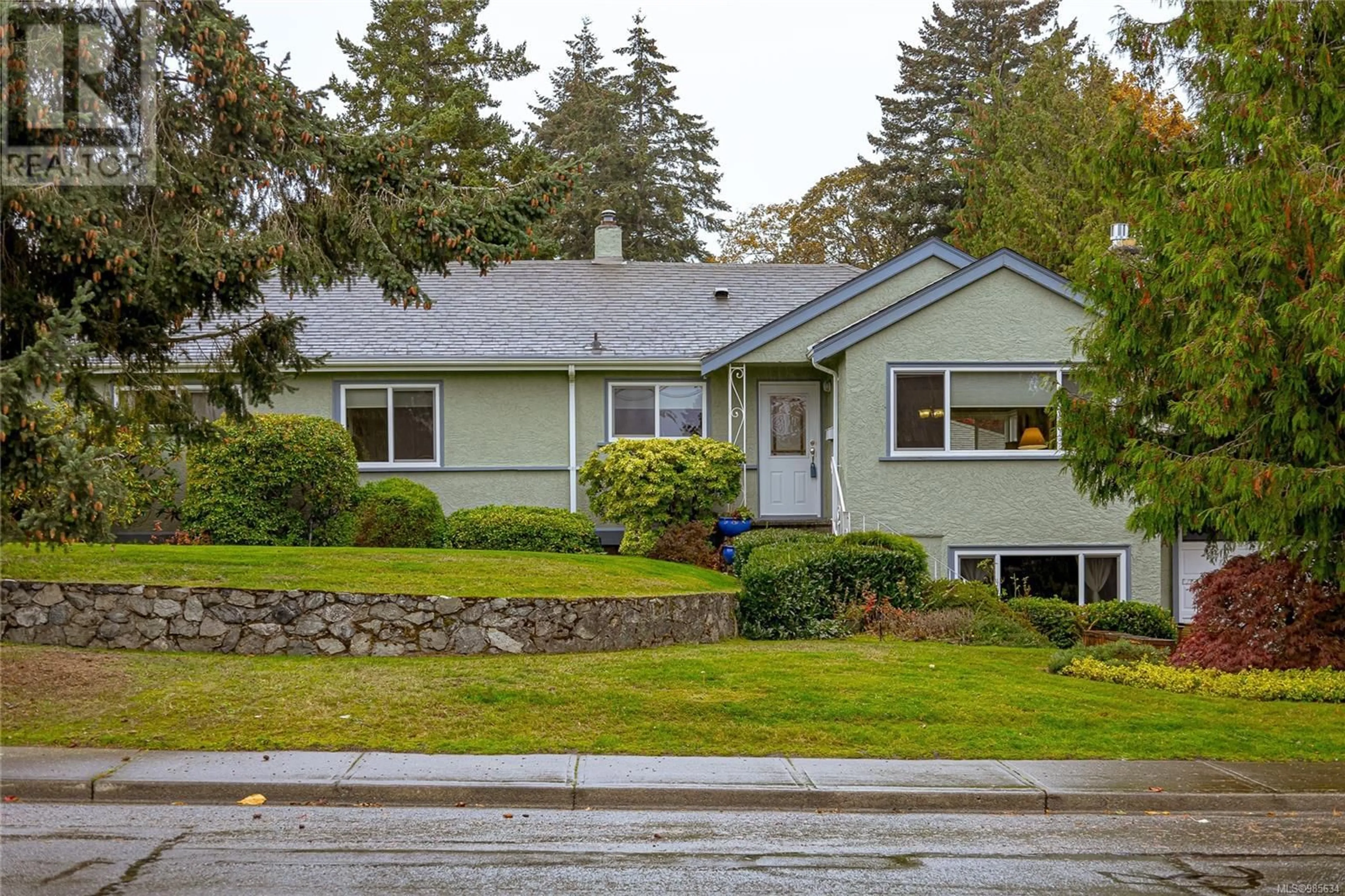 Home with vinyl exterior material, street for A 3972 Cedar Hill Cross Rd, Saanich British Columbia V8P2N7