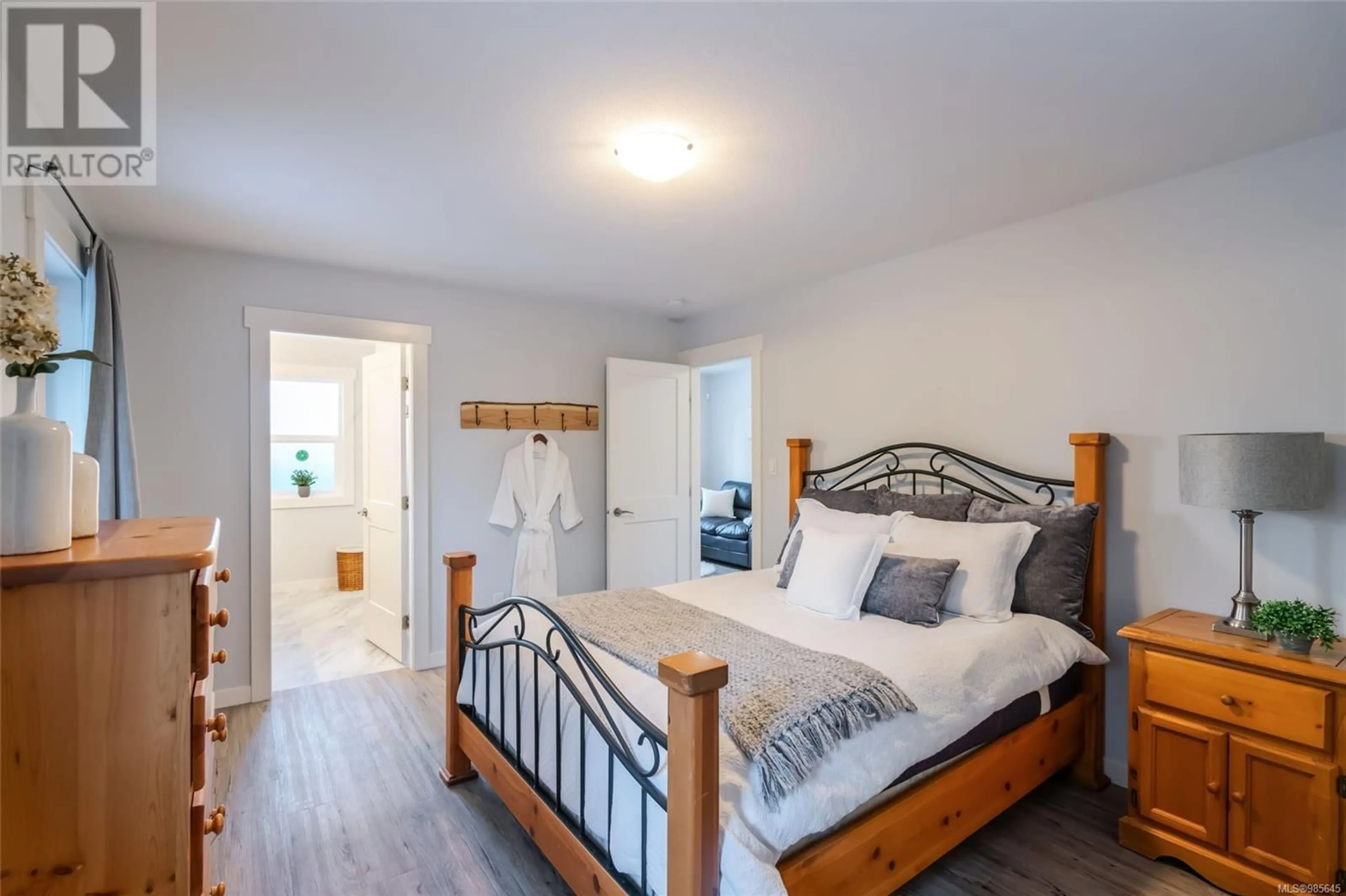 Bedroom with bed, wood/laminate floor for 1545B Willemar Rd, Courtenay British Columbia V9N3M2