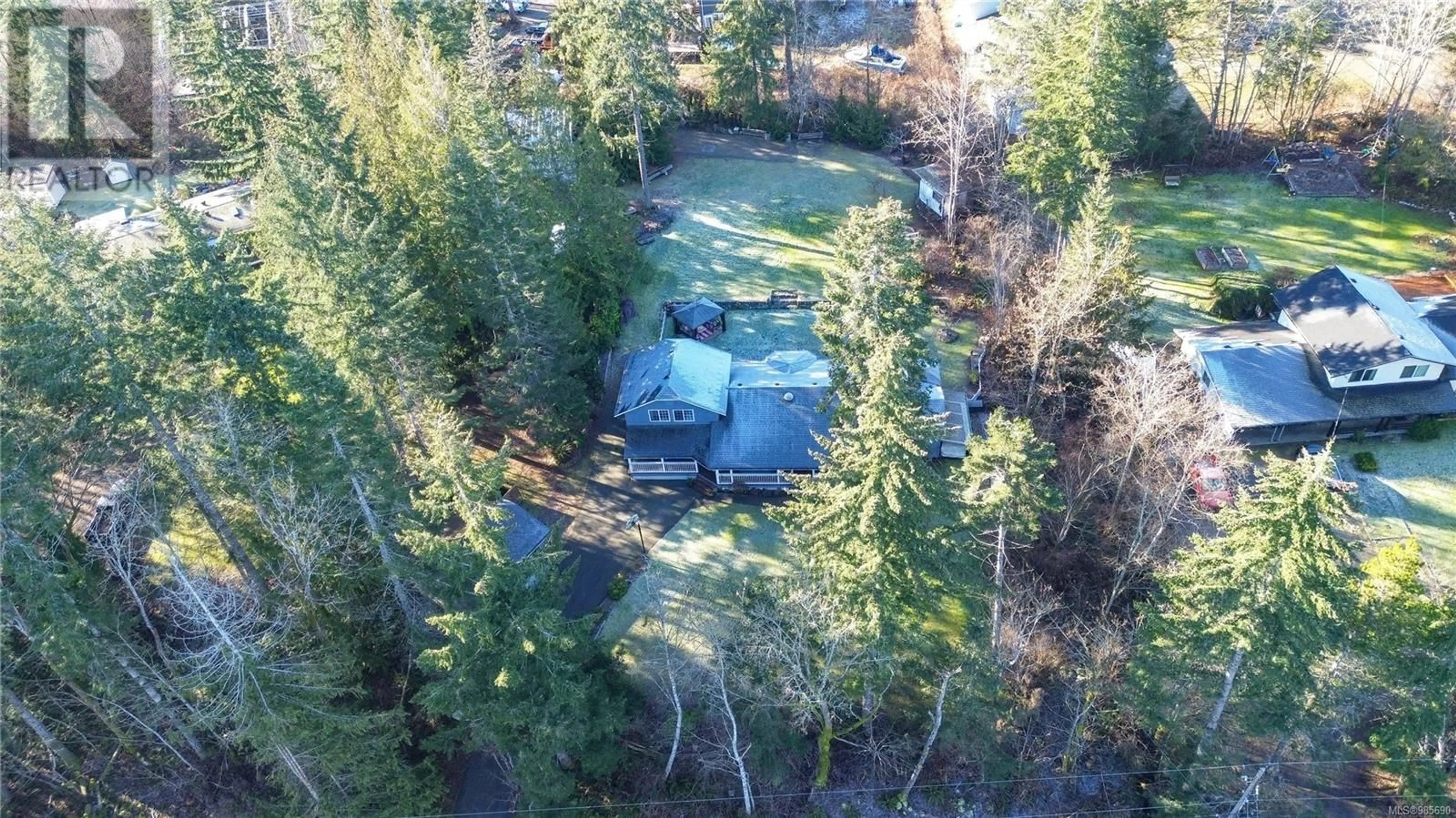 A pic from outside/outdoor area/front of a property/back of a property/a pic from drone, forest/trees view for 777 Salsbury Rd, Courtenay British Columbia V9N9M2