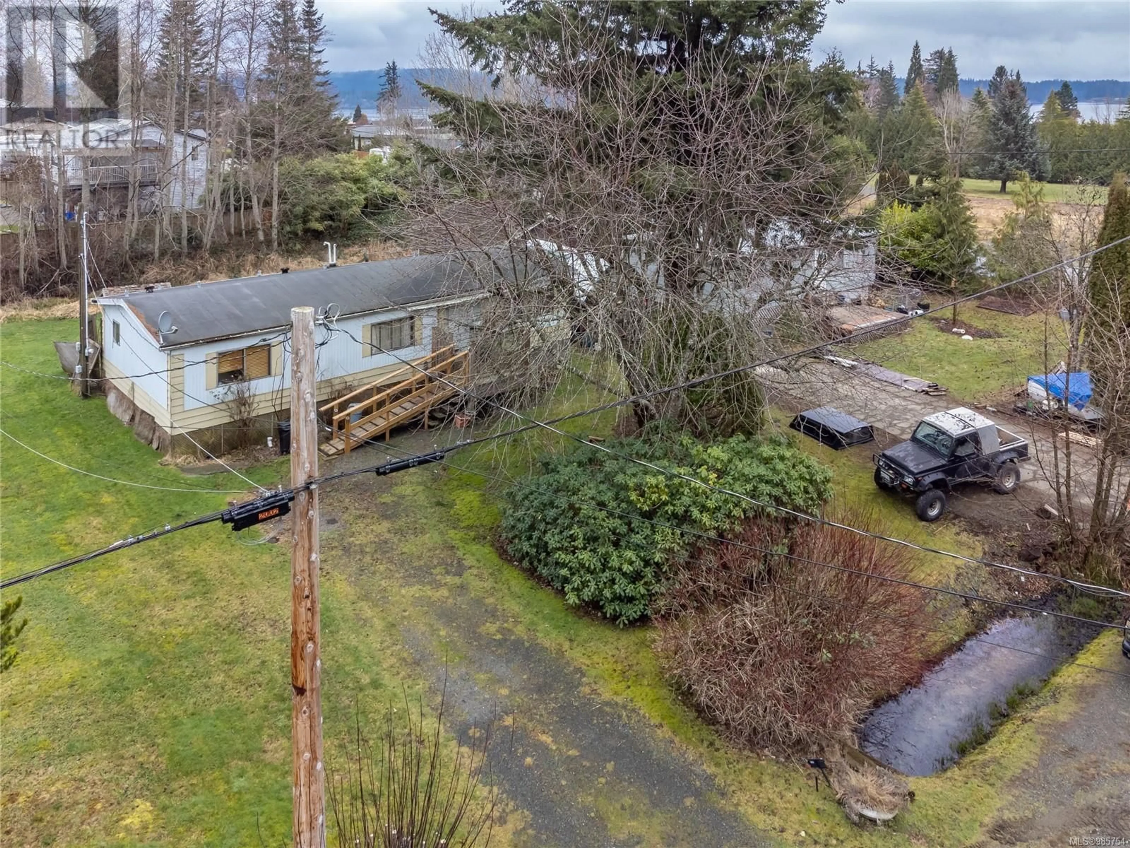 A pic from outside/outdoor area/front of a property/back of a property/a pic from drone, unknown for 1780 McDonald Rd, Campbell River British Columbia V9W5K1