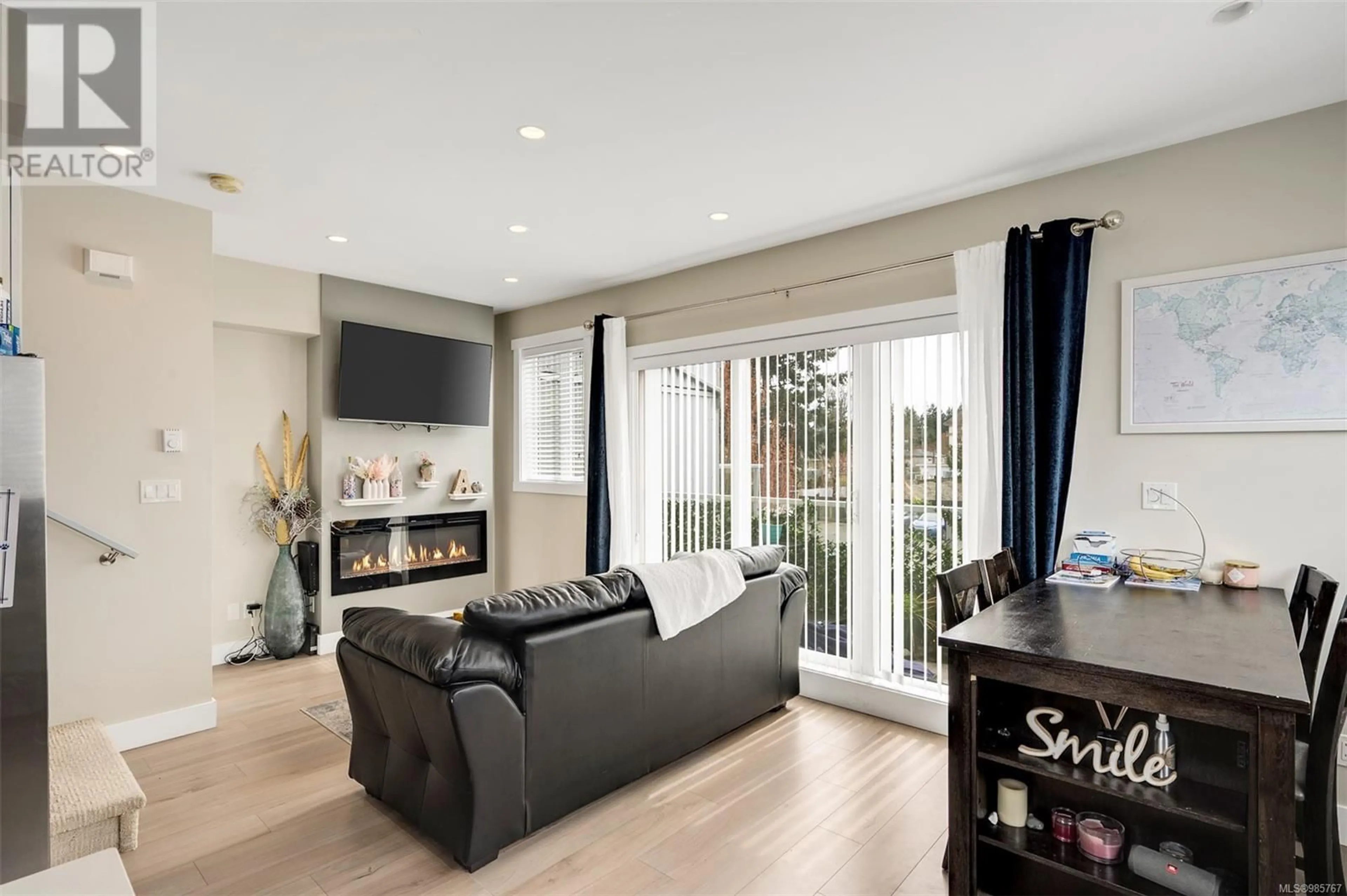 Living room with furniture, wood/laminate floor for 116 2737 Jacklin Rd, Langford British Columbia V9B0K4