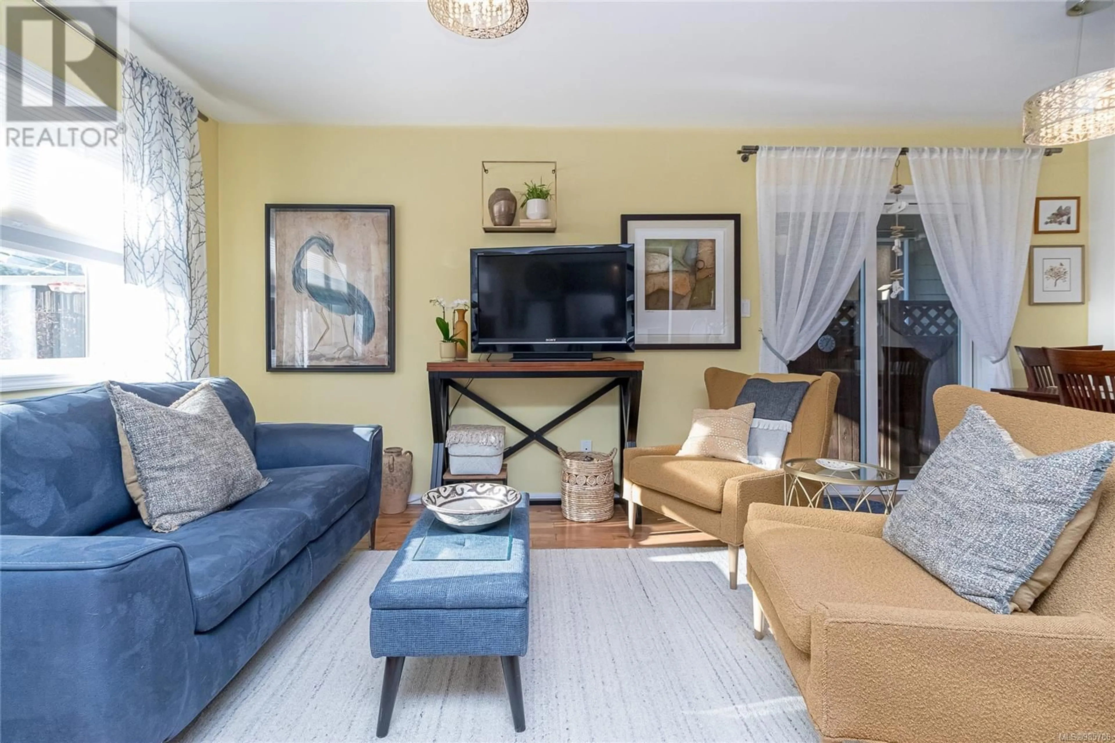 Living room with furniture, wood/laminate floor for 1002 Fashoda Pl, Langford British Columbia V9C3X1