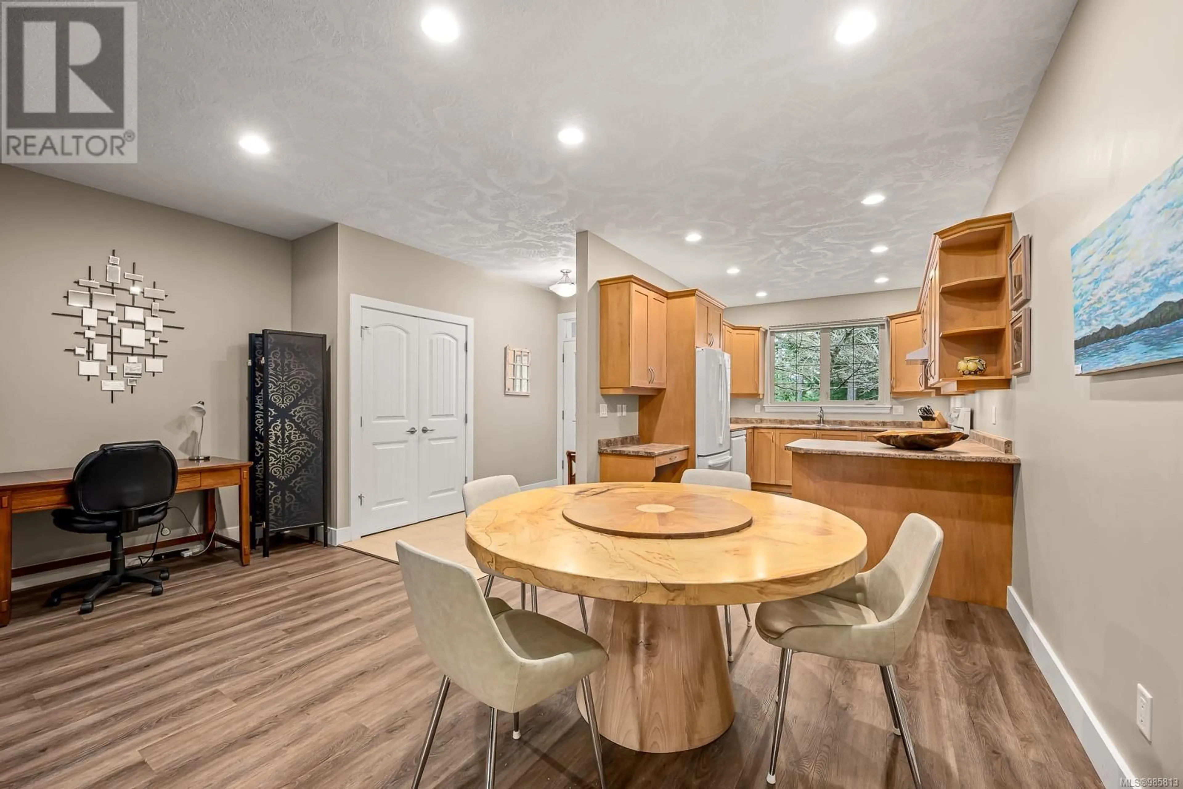 Open concept kitchen, wood/laminate floor for 133 2315 Suffolk Cres, Courtenay British Columbia V9N3Z4