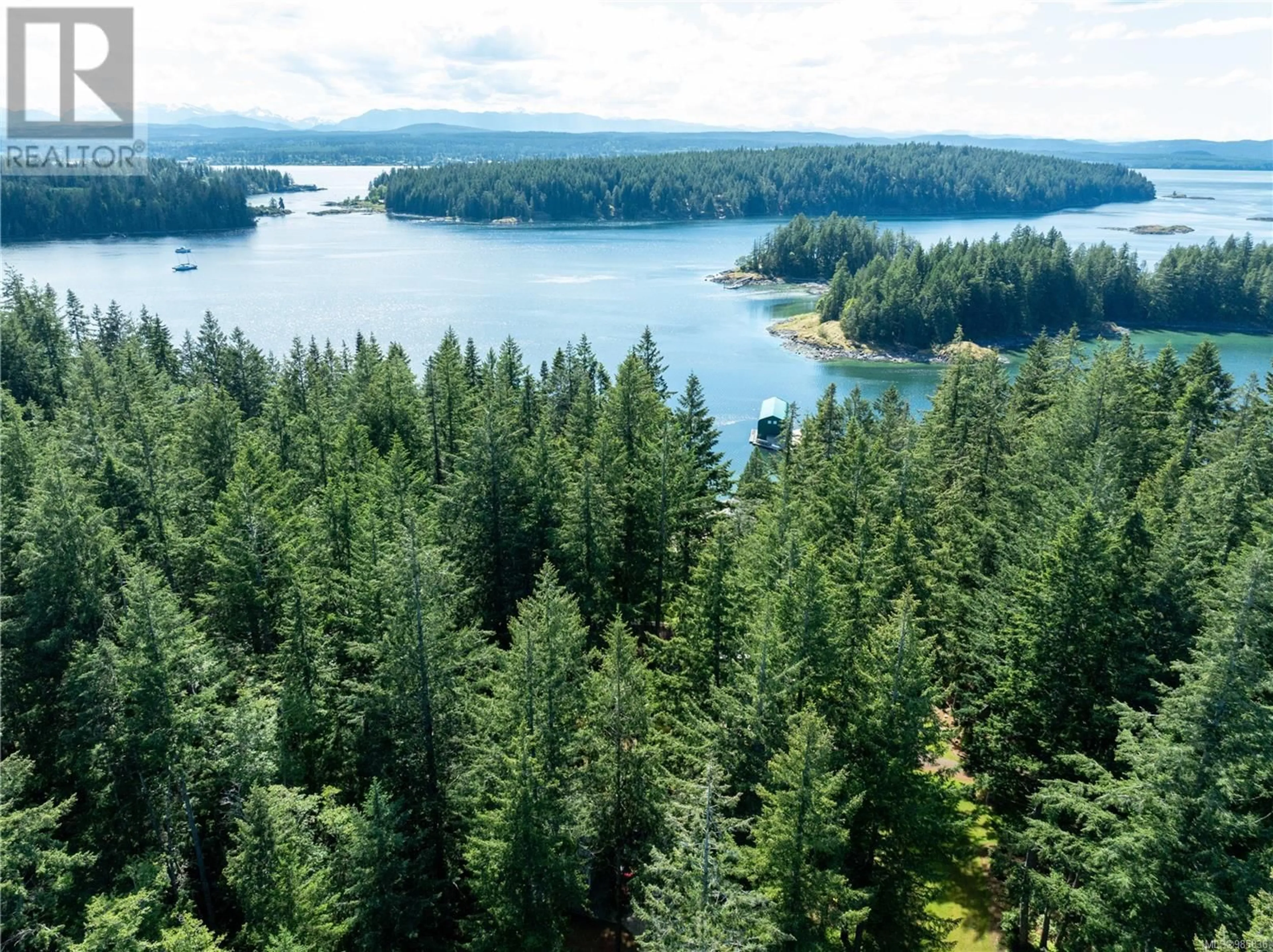 A pic from outside/outdoor area/front of a property/back of a property/a pic from drone, water/lake/river/ocean view for 1157 West Rd, Quadra Island British Columbia V0N2P0