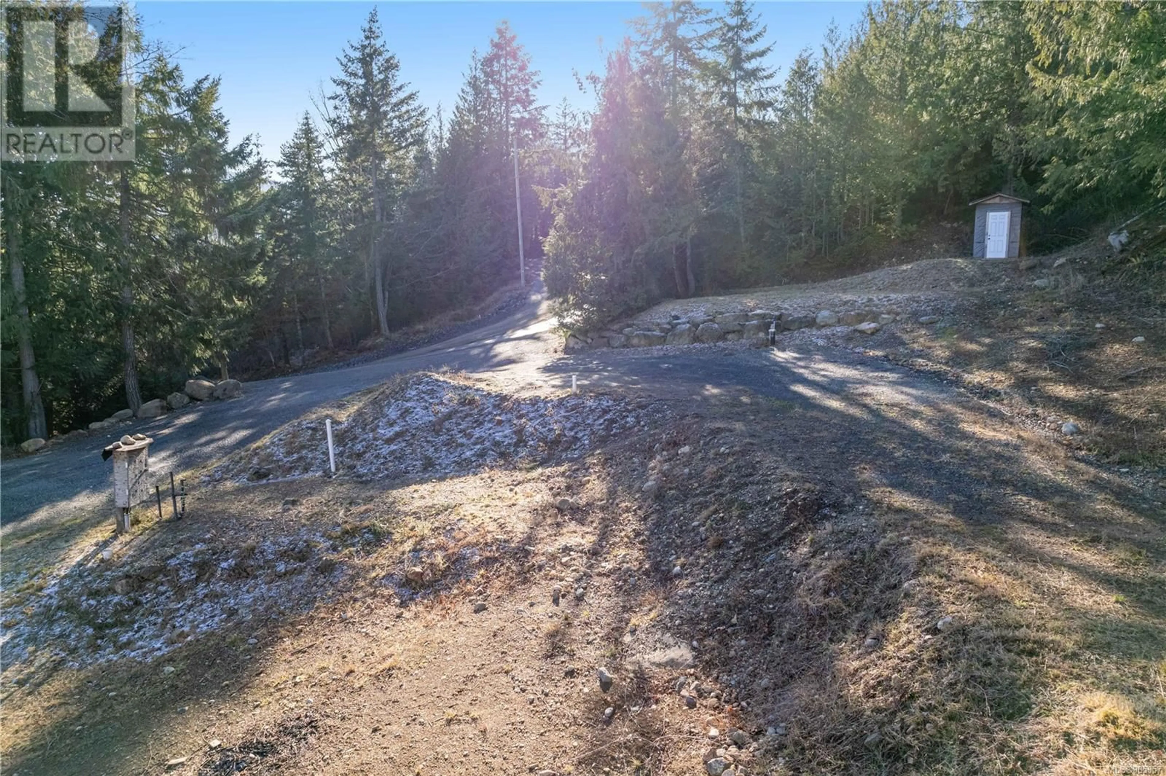 A pic from outside/outdoor area/front of a property/back of a property/a pic from drone, forest/trees view for 1725 Warn Way, Qualicum Beach British Columbia V9K2S3