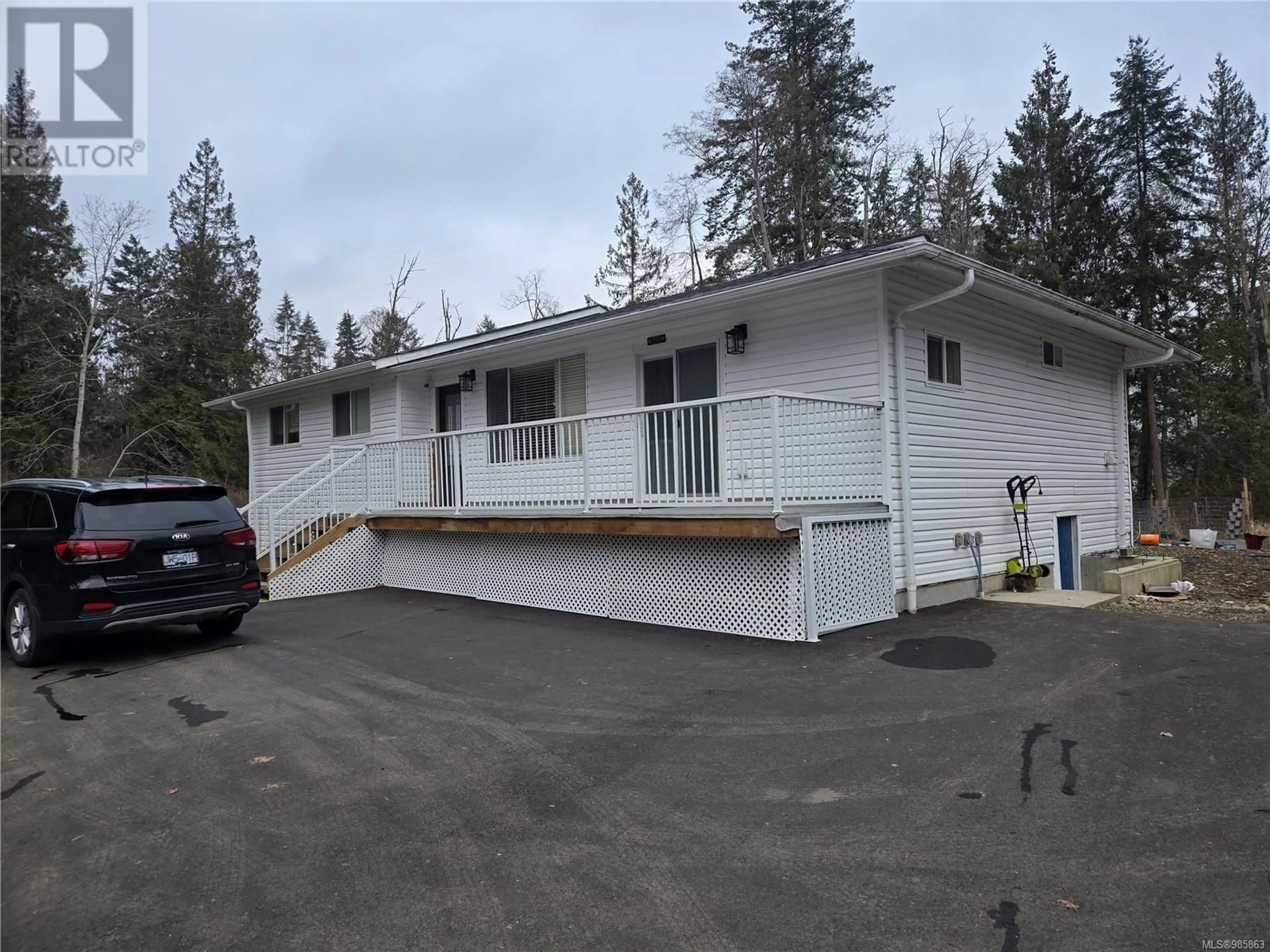 Home with vinyl exterior material, street for 2275 Island Hwy E, Nanoose Bay British Columbia V9P9E2