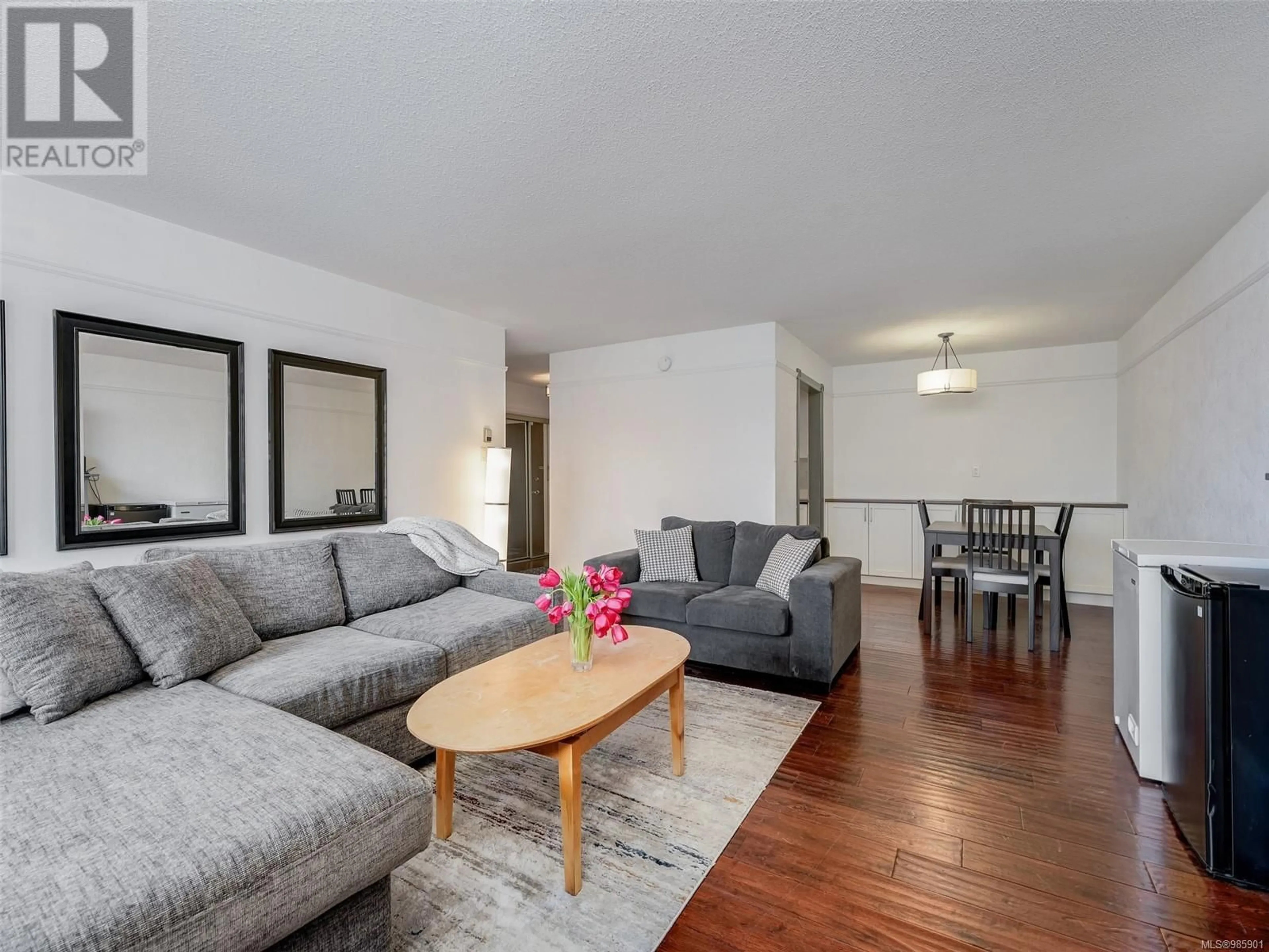 Living room with furniture, wood/laminate floor for 108 1870 McKenzie Ave, Saanich British Columbia V8N4X3