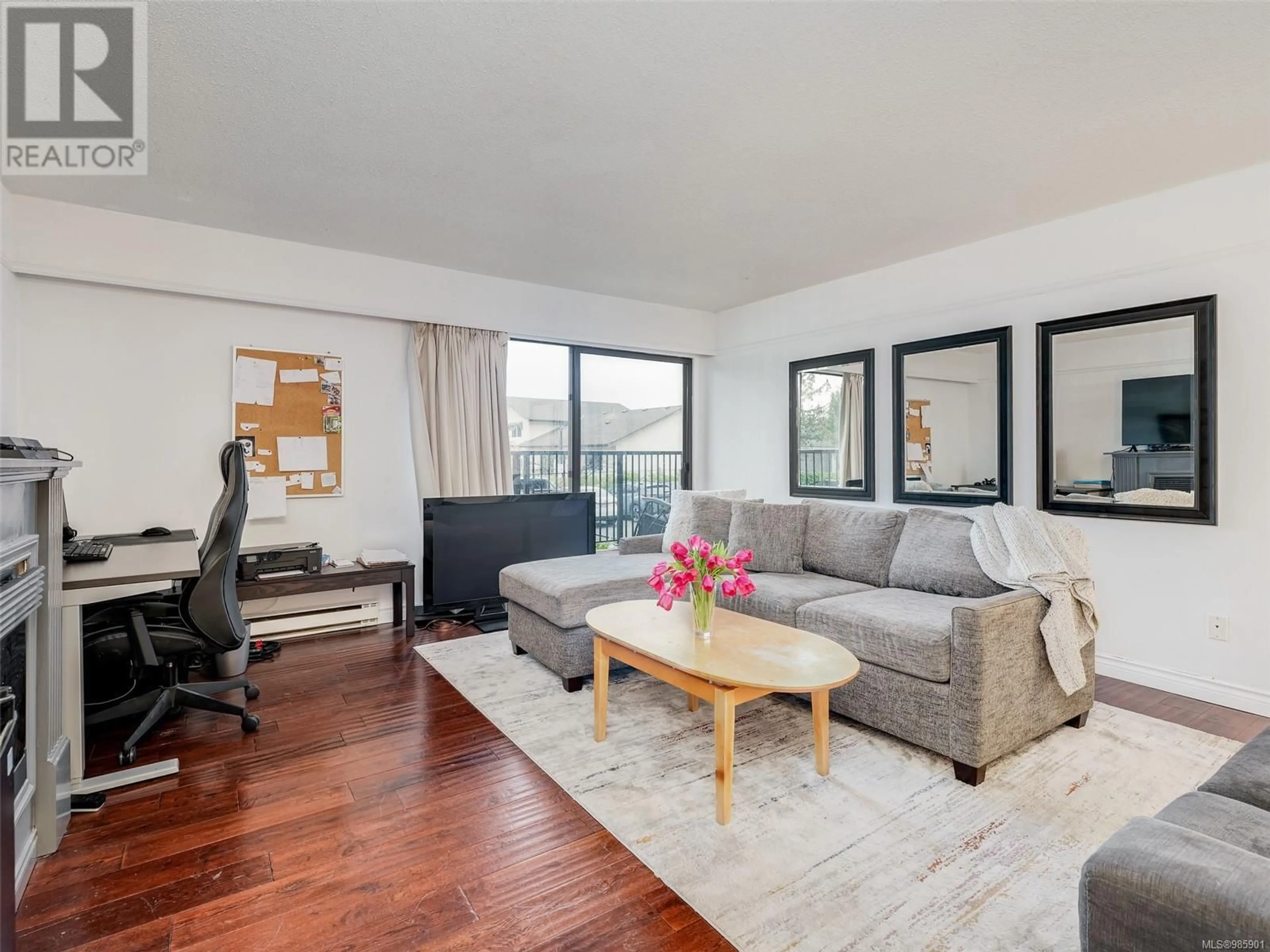 Living room with furniture, wood/laminate floor for 108 1870 McKenzie Ave, Saanich British Columbia V8N4X3