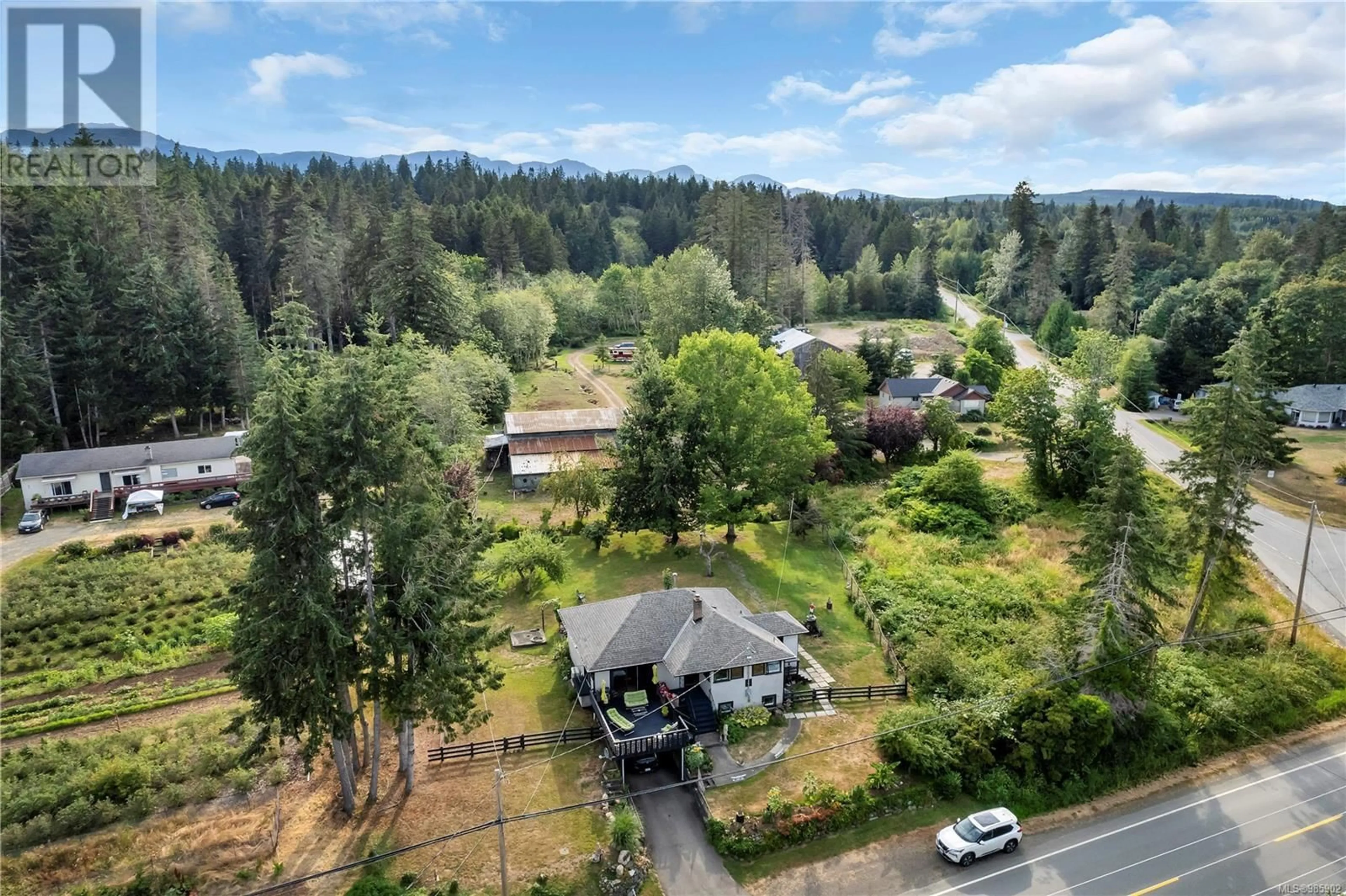 A pic from outside/outdoor area/front of a property/back of a property/a pic from drone, forest/trees view for 6689 ISLAND HIGHWAY SOUTH, Fanny Bay British Columbia V0R1W0