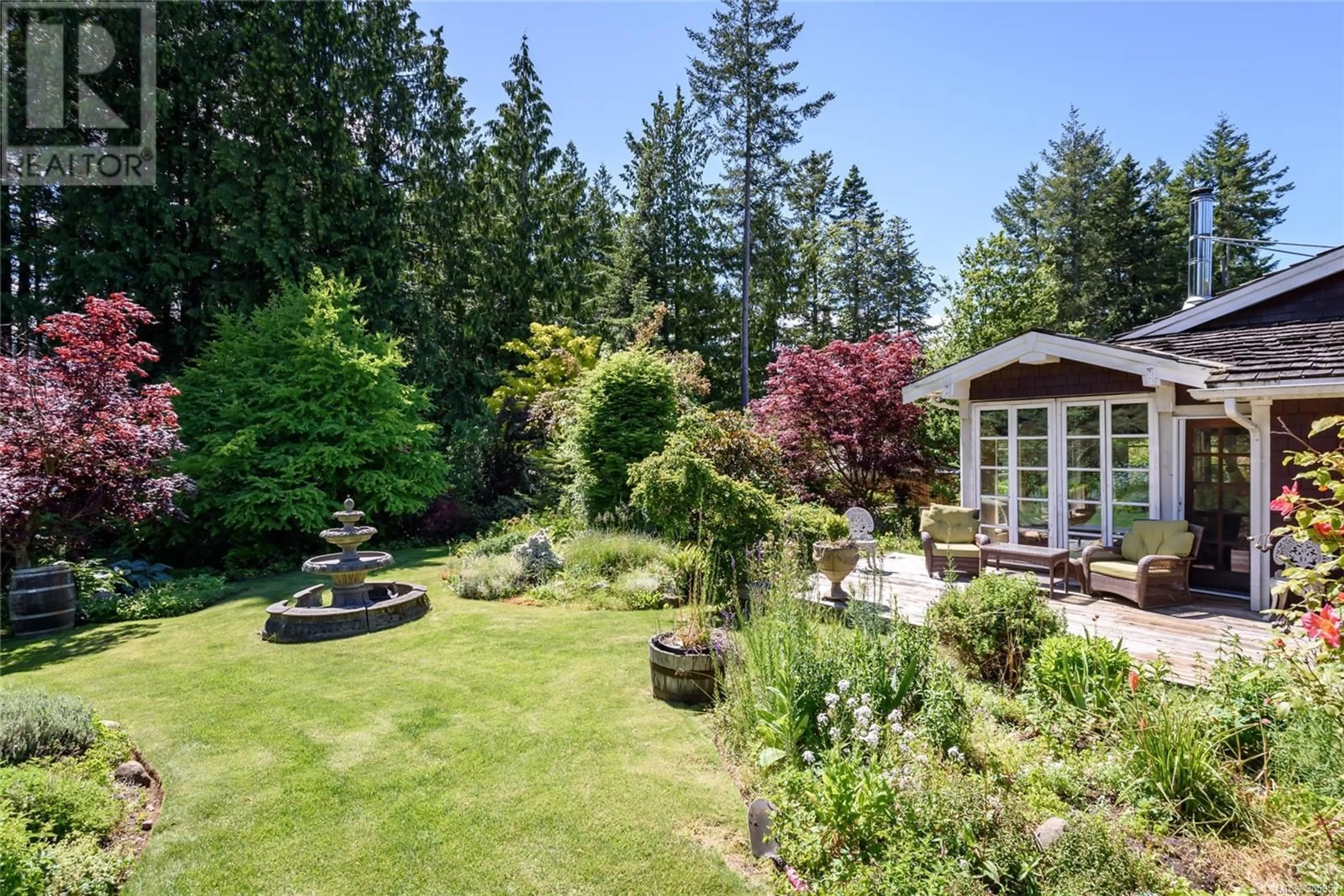 A pic from outside/outdoor area/front of a property/back of a property/a pic from drone, forest/trees view for 7679 VICTOR LANE, Fanny Bay British Columbia V0R1W0