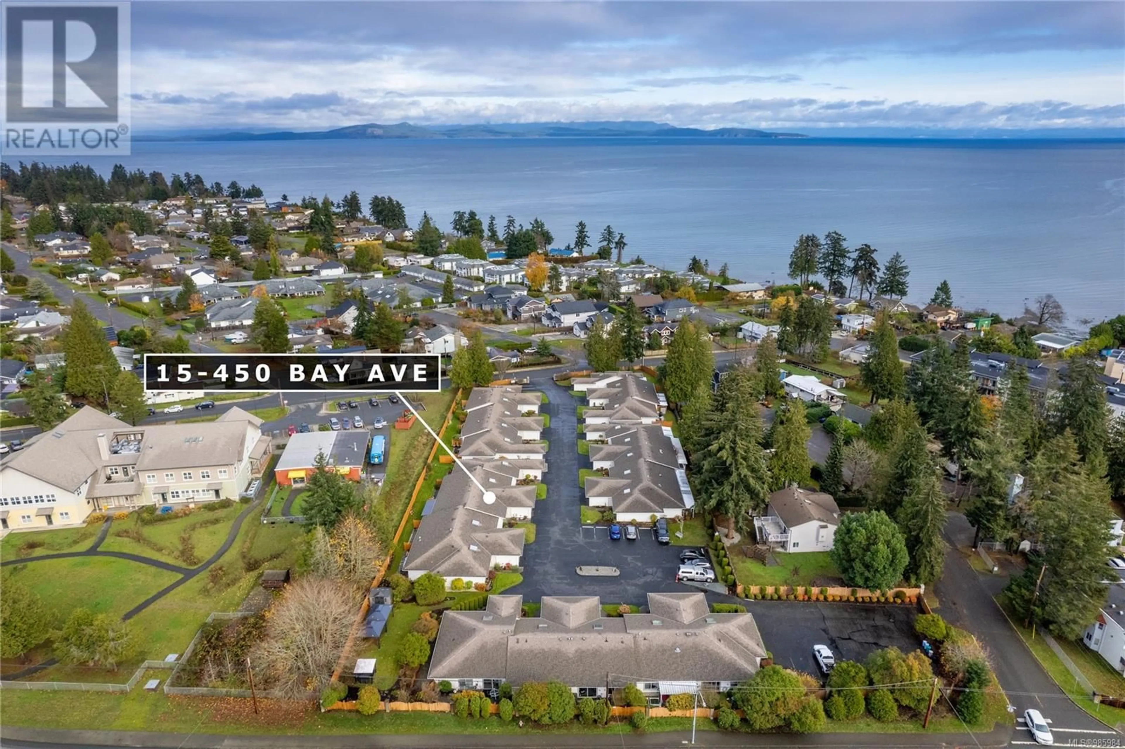 A pic from outside/outdoor area/front of a property/back of a property/a pic from drone, water/lake/river/ocean view for 15 450 Bay Ave, Parksville British Columbia V9P2K2