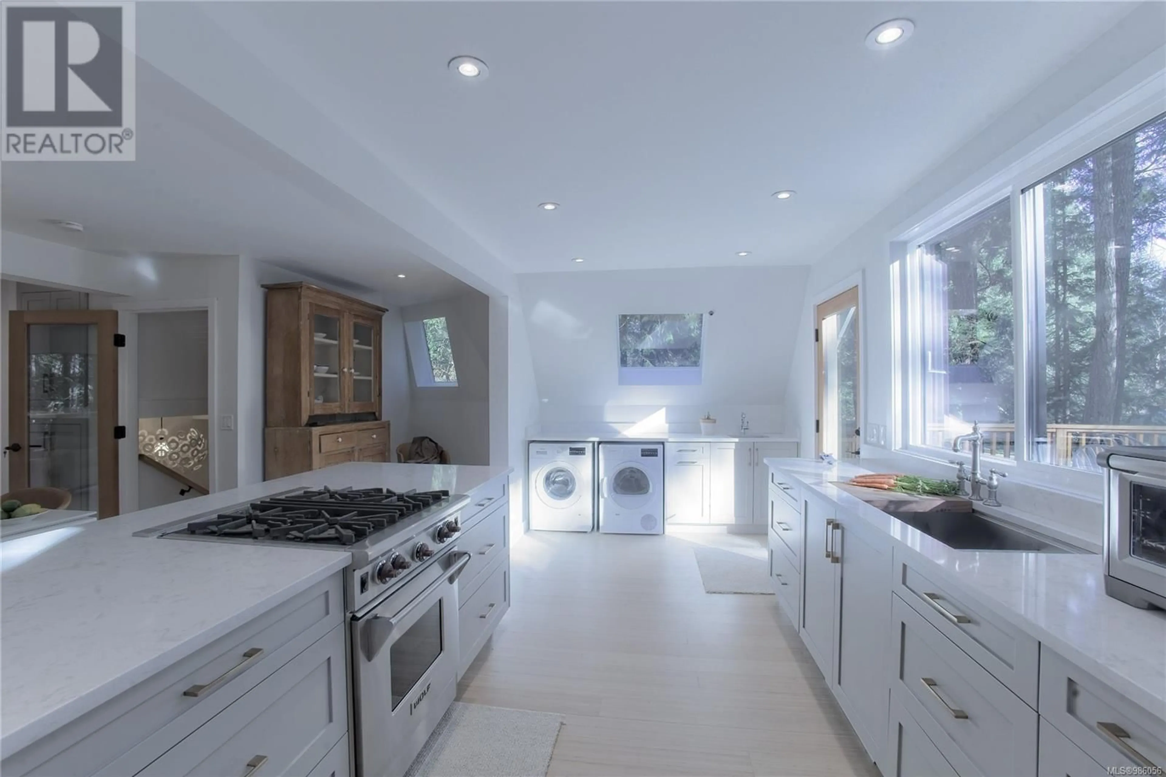 Kitchen with laundary machines, ceramic/tile floor for 141 Cedar Lane, Salt Spring British Columbia V8K1R1