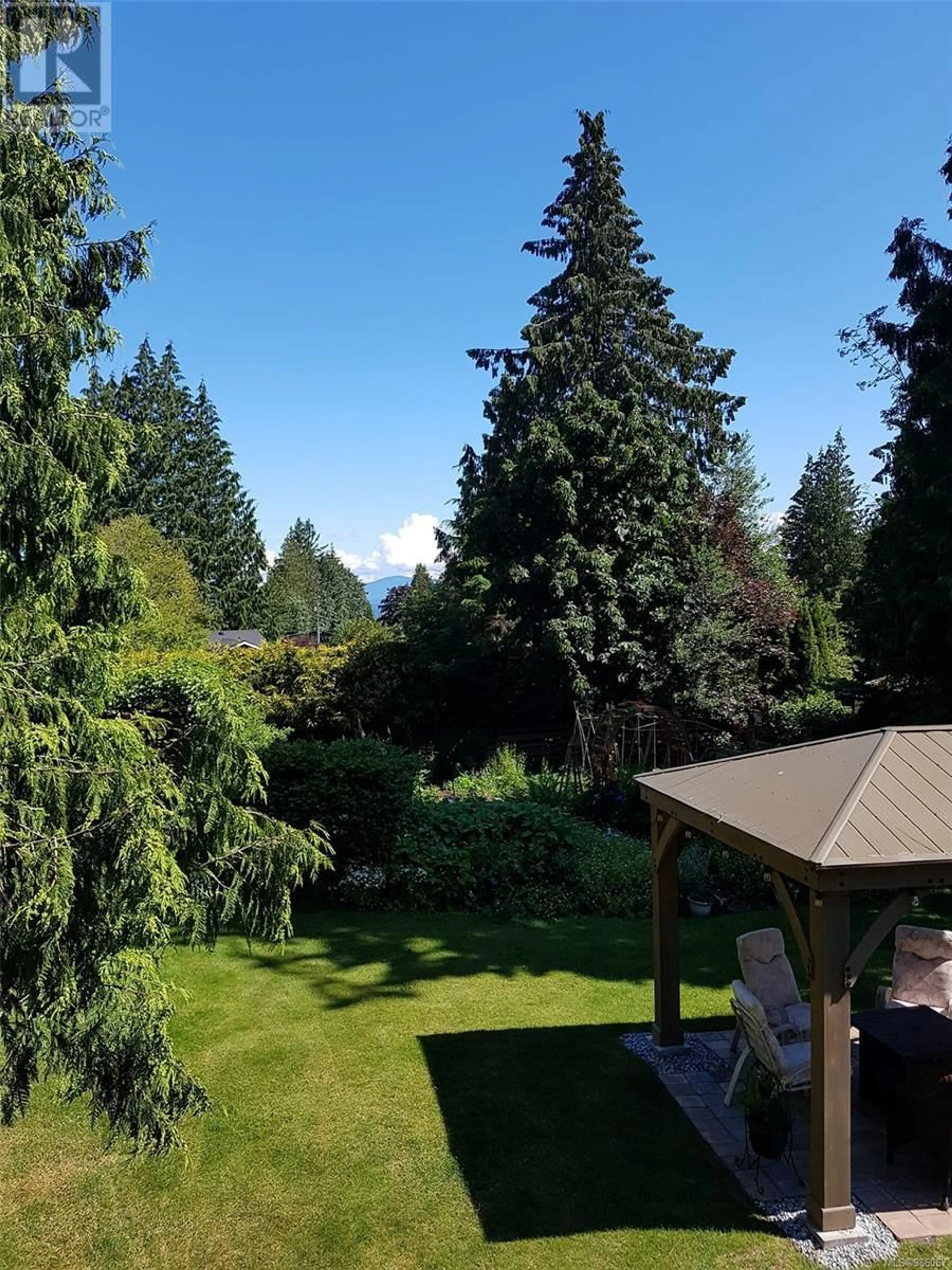 A pic from outside/outdoor area/front of a property/back of a property/a pic from drone, forest/trees view for 795 Canyon Crescent Rd, Qualicum Beach British Columbia V9K1L4