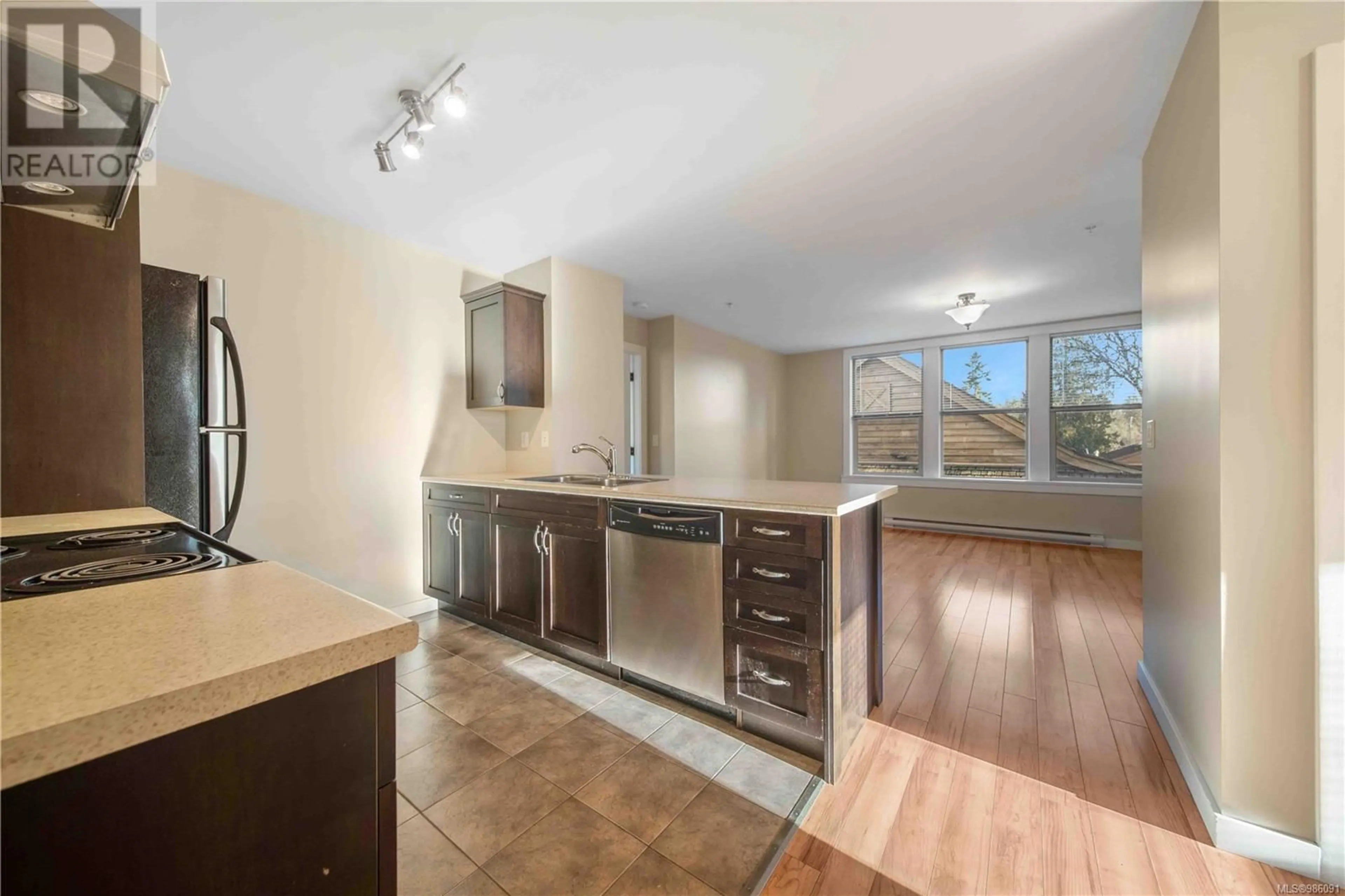 Open concept kitchen, unknown for 102 5281 Rutherford Rd, Nanaimo British Columbia V9T5N9