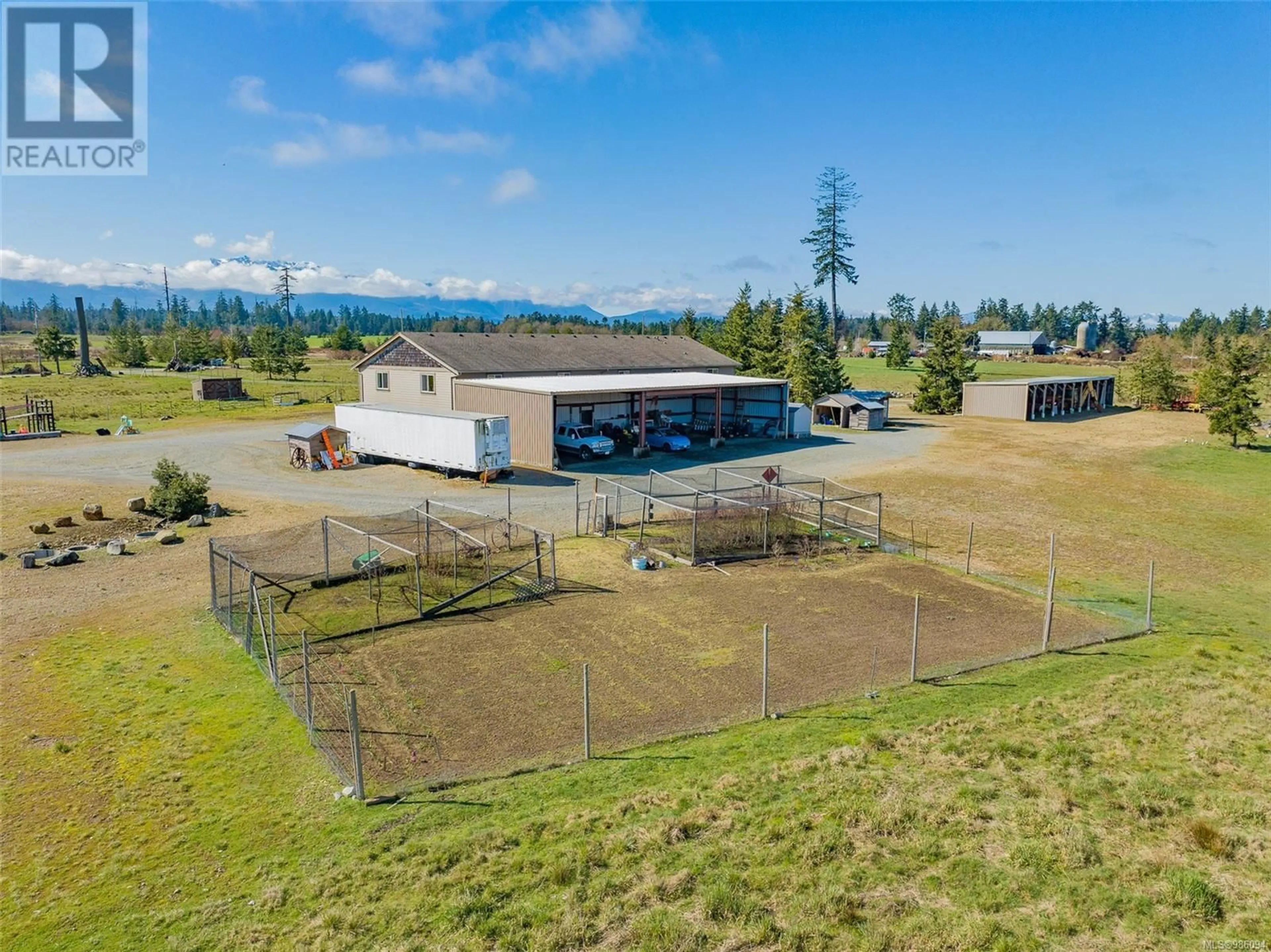 A pic from outside/outdoor area/front of a property/back of a property/a pic from drone, mountain view for 1355 Hodges Rd, French Creek British Columbia V9P2B5