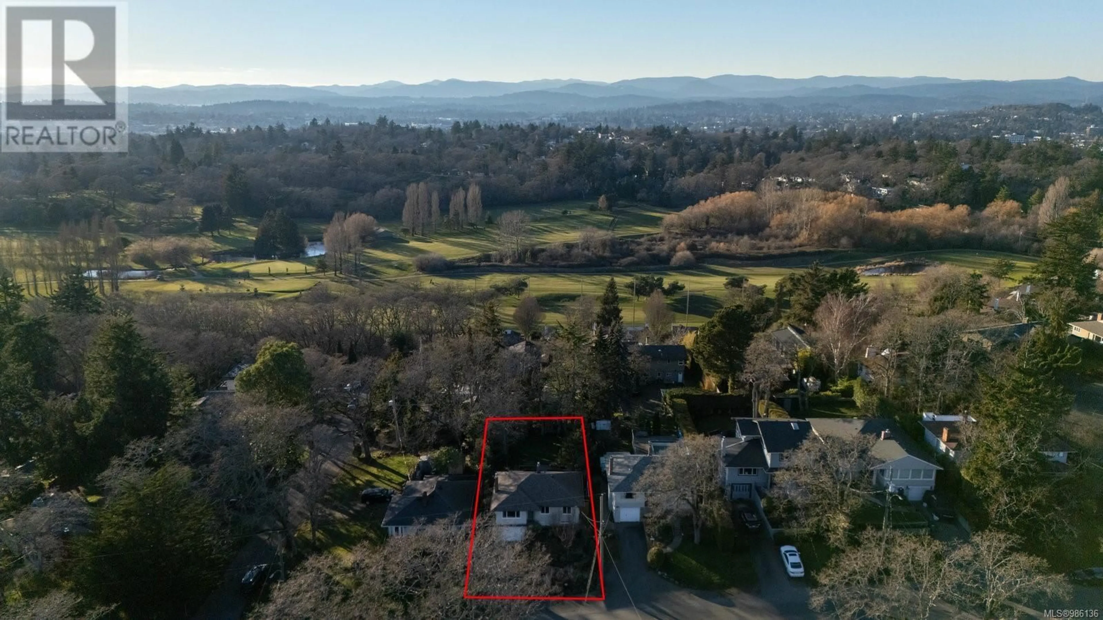 A pic from outside/outdoor area/front of a property/back of a property/a pic from drone, mountain view for 3606 Doncaster Dr, Saanich British Columbia V8P3W4