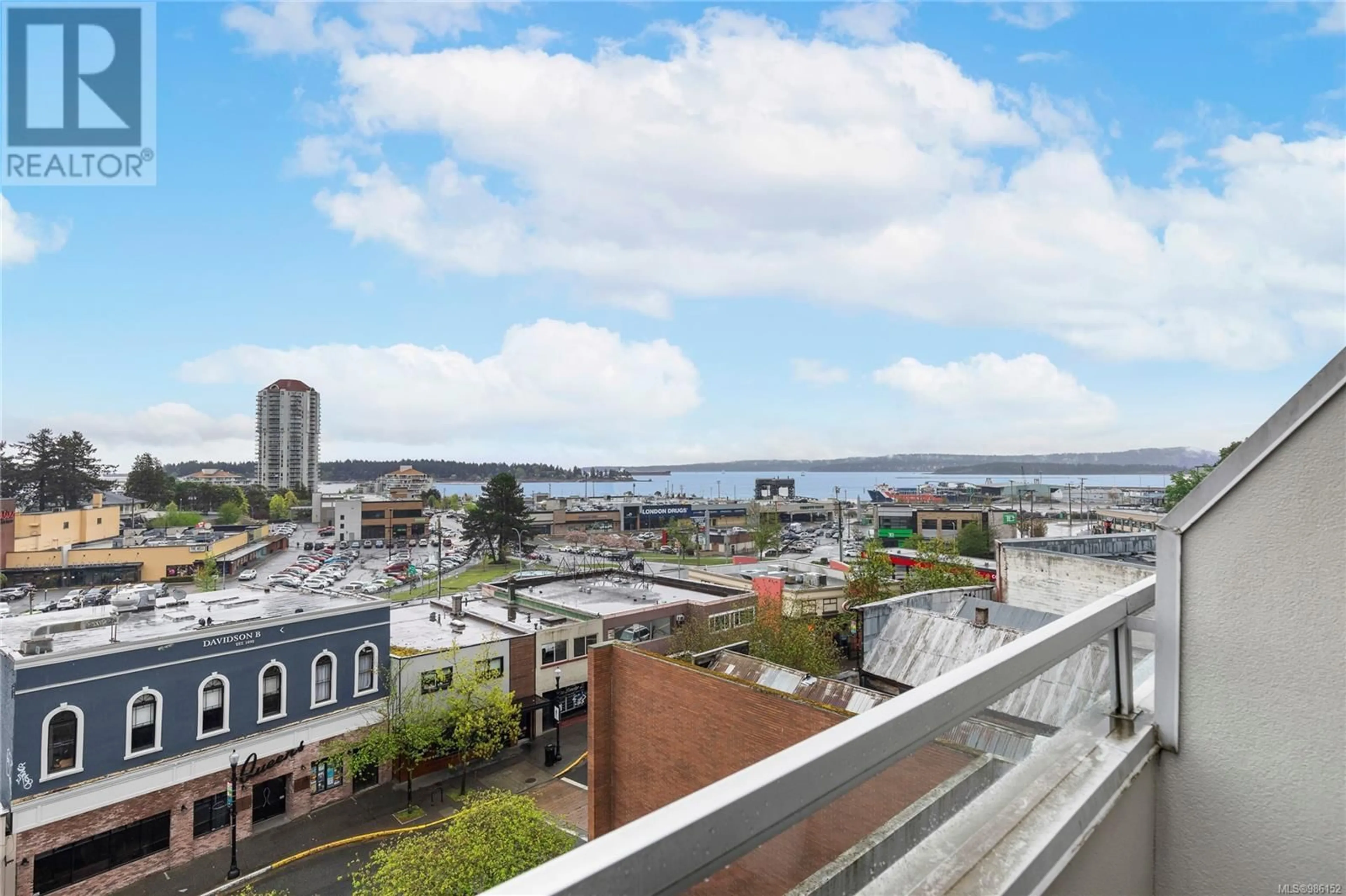 Patio, city buildings view from balcony for 209 30 Cavan St, Nanaimo British Columbia V9R6K3