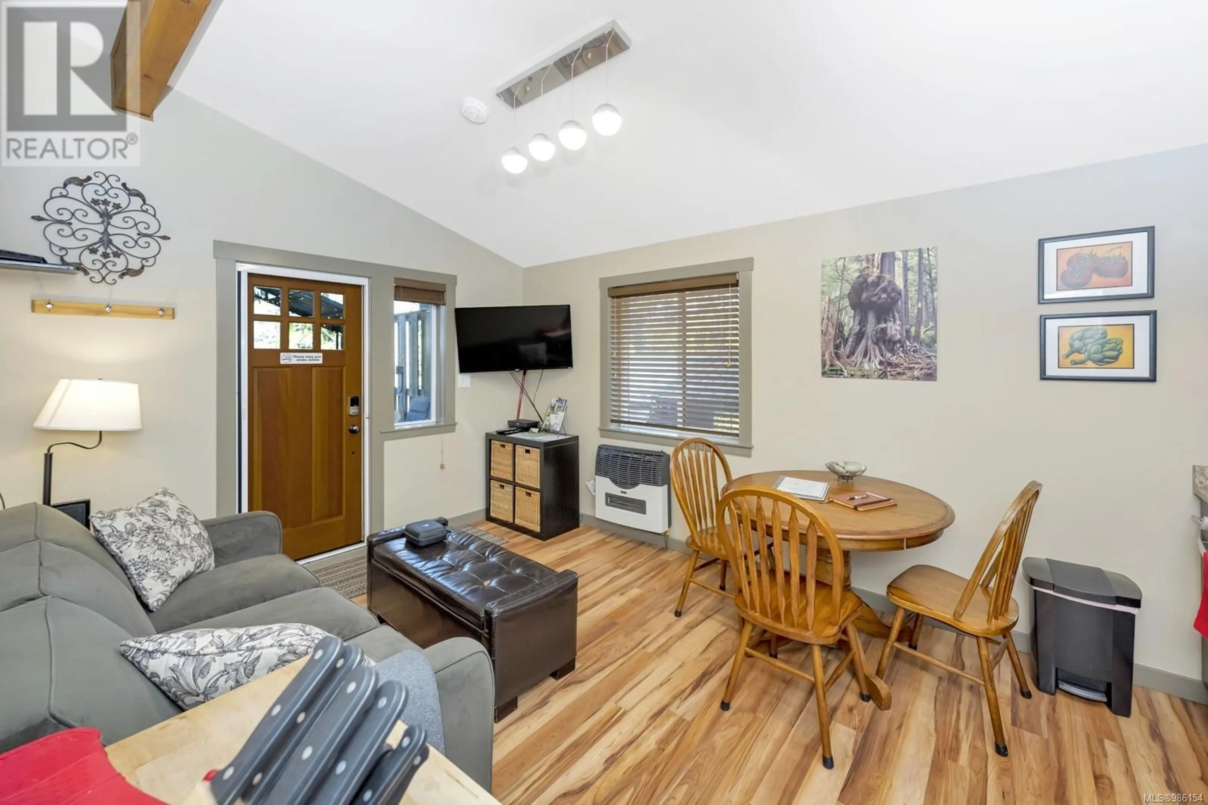 Living room with furniture, wood/laminate floor for 37 6574 Baird Rd, Port Renfrew British Columbia V0S1K0