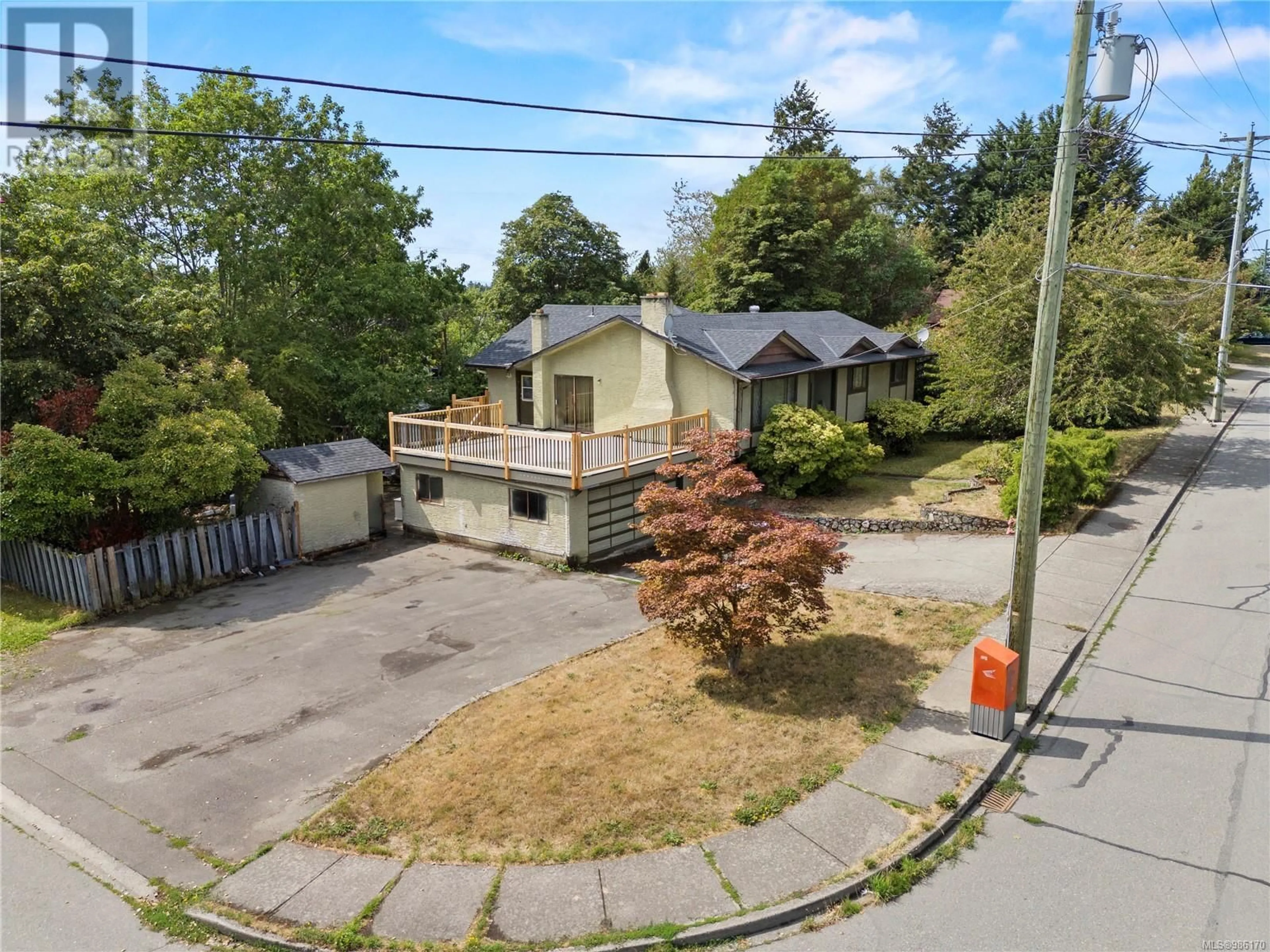 A pic from outside/outdoor area/front of a property/back of a property/a pic from drone, street for 3978 Cedar Hill Cross Rd, Saanich British Columbia V8P2N7