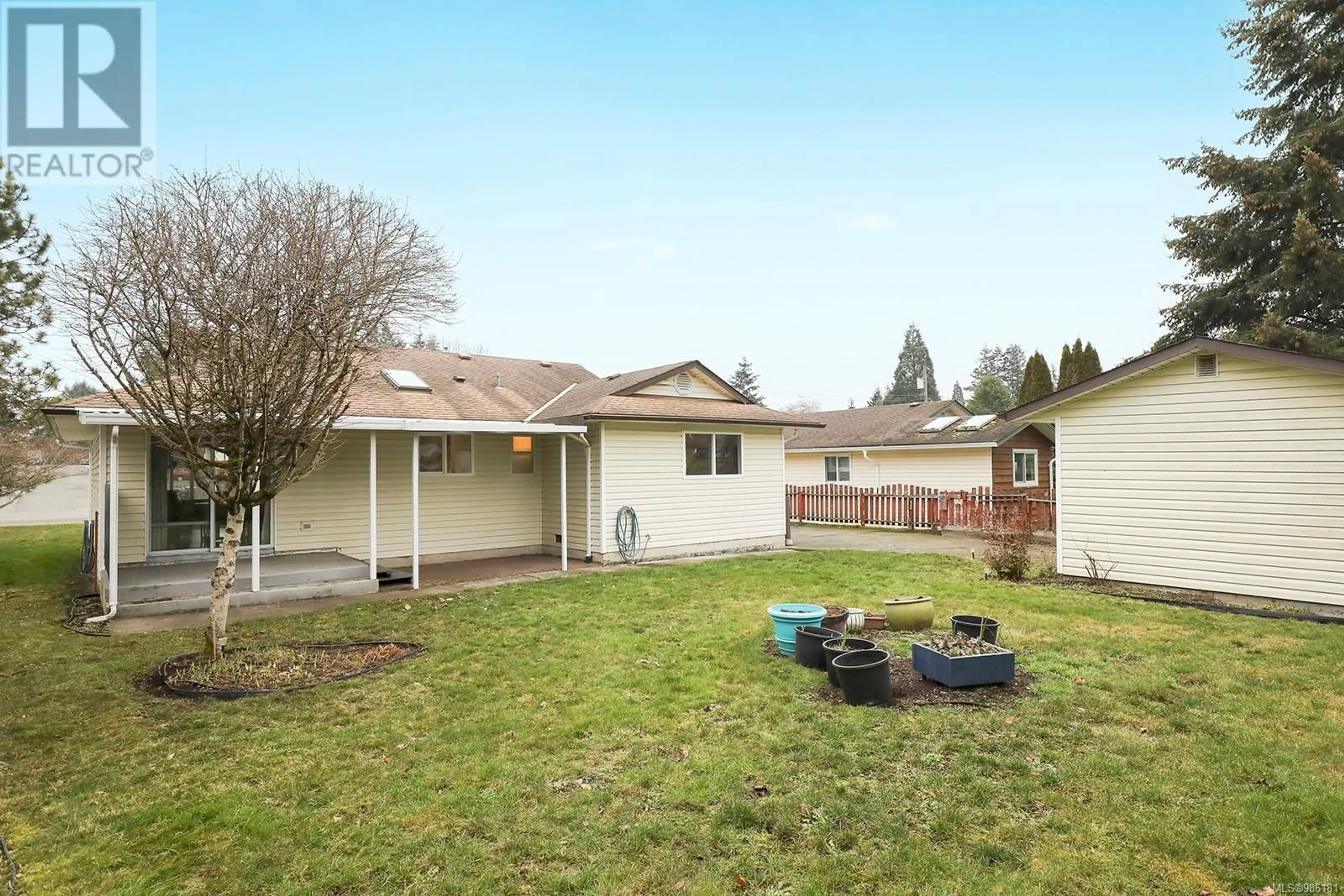 A pic from outside/outdoor area/front of a property/back of a property/a pic from drone, street for 1795 Tull Ave, Courtenay British Columbia V9N6G5