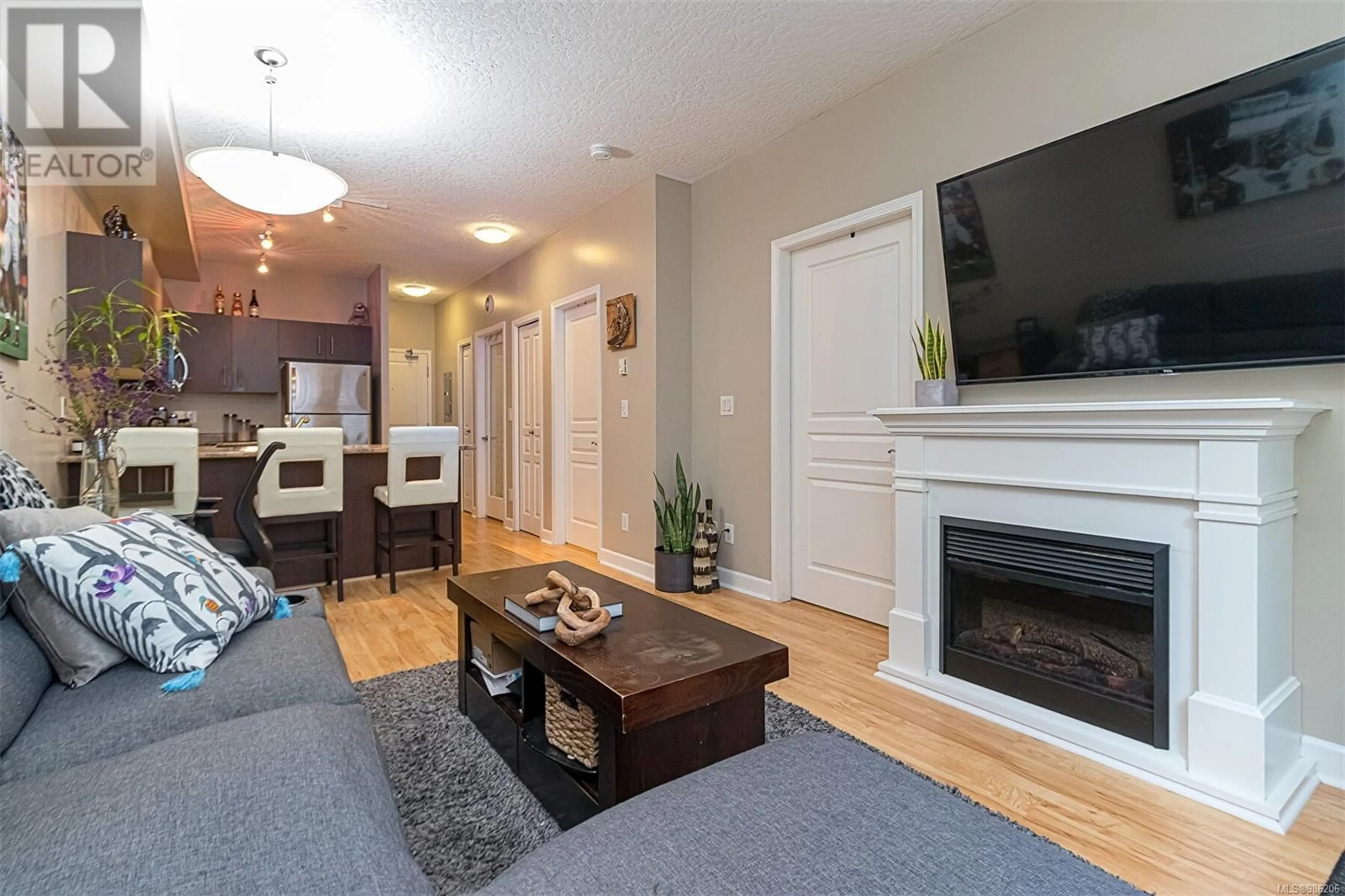 Living room with furniture, wood/laminate floor for 207 825 Goldstream Ave, Langford British Columbia V9B0C3