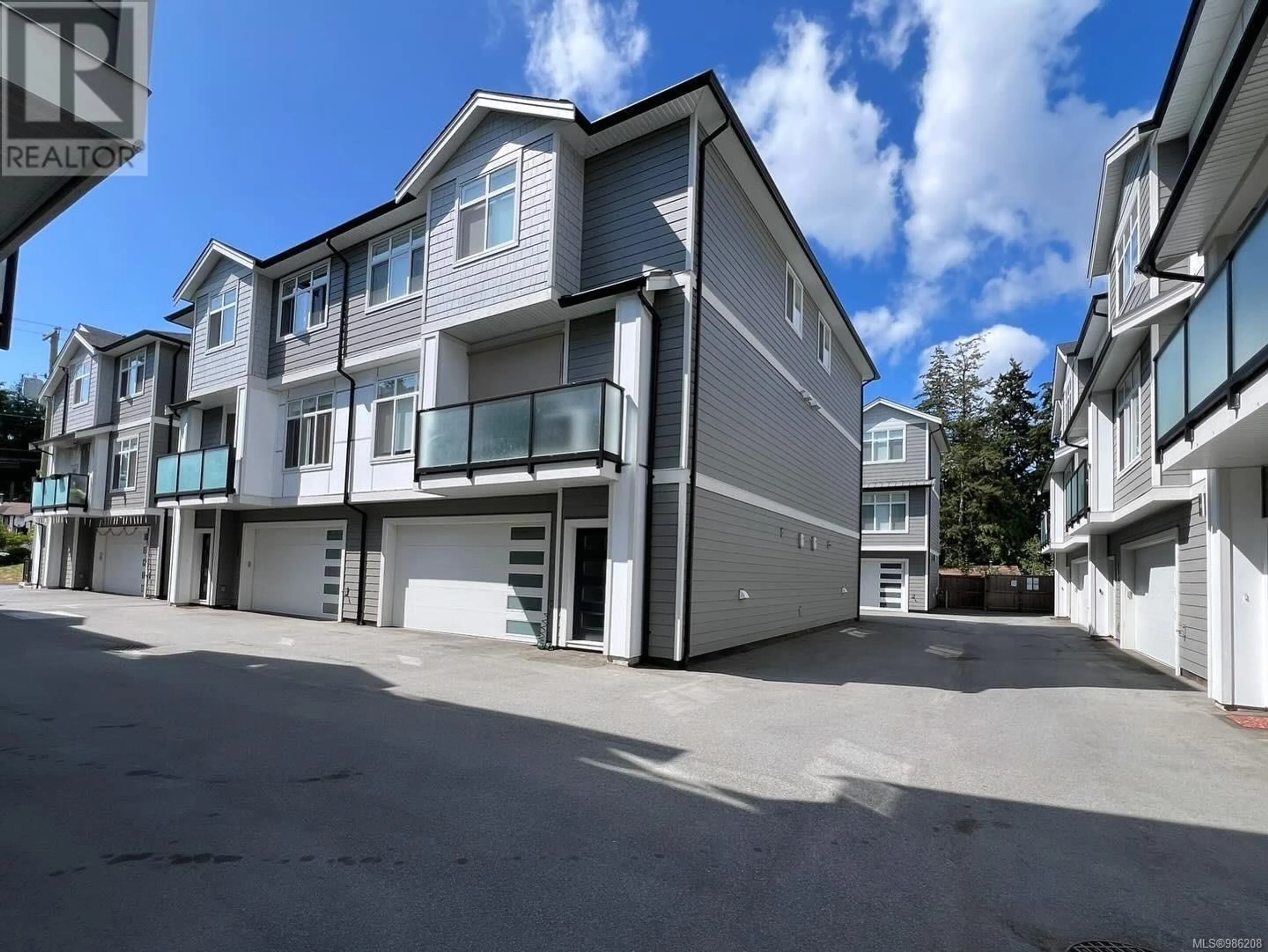 A pic from outside/outdoor area/front of a property/back of a property/a pic from drone, street for 103 946 Jenkins Ave, Langford British Columbia V9B2N7