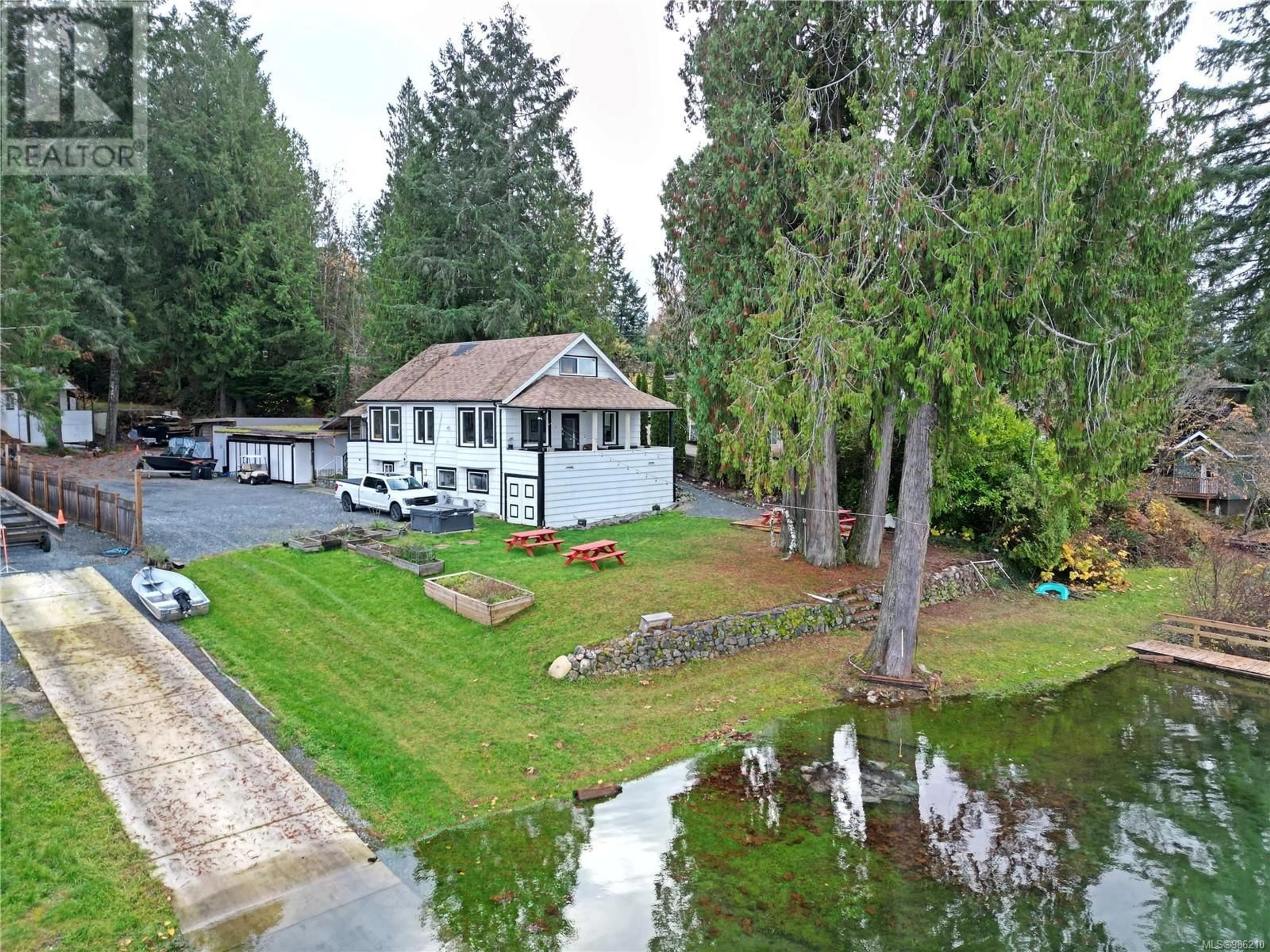 A pic from outside/outdoor area/front of a property/back of a property/a pic from drone, water/lake/river/ocean view for 8585 Bothwell Rd, Port Alberni British Columbia V9Y9B6