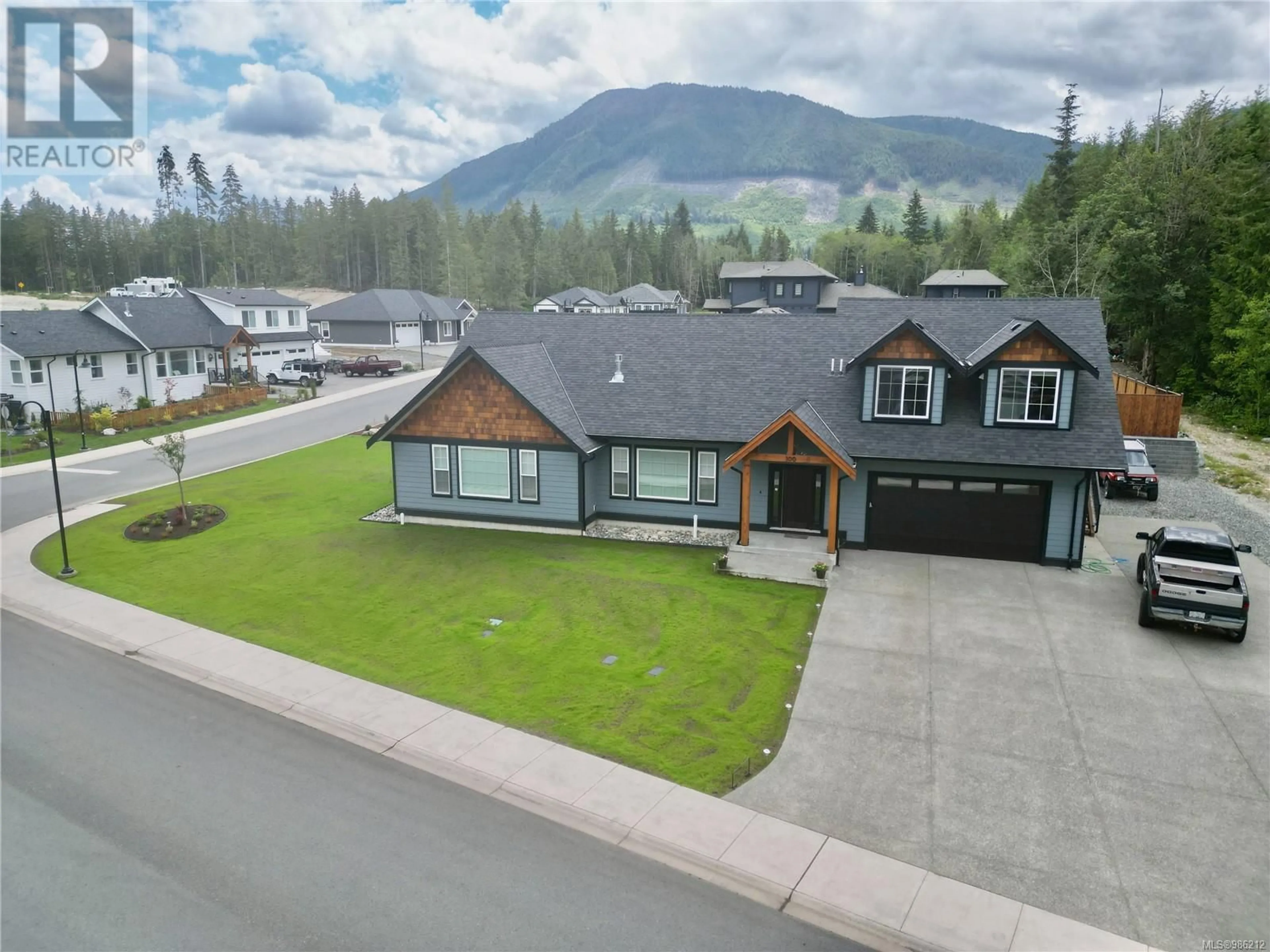 A pic from outside/outdoor area/front of a property/back of a property/a pic from drone, mountain view for 100 Driftwood Terr, Lake Cowichan British Columbia V0R2G0