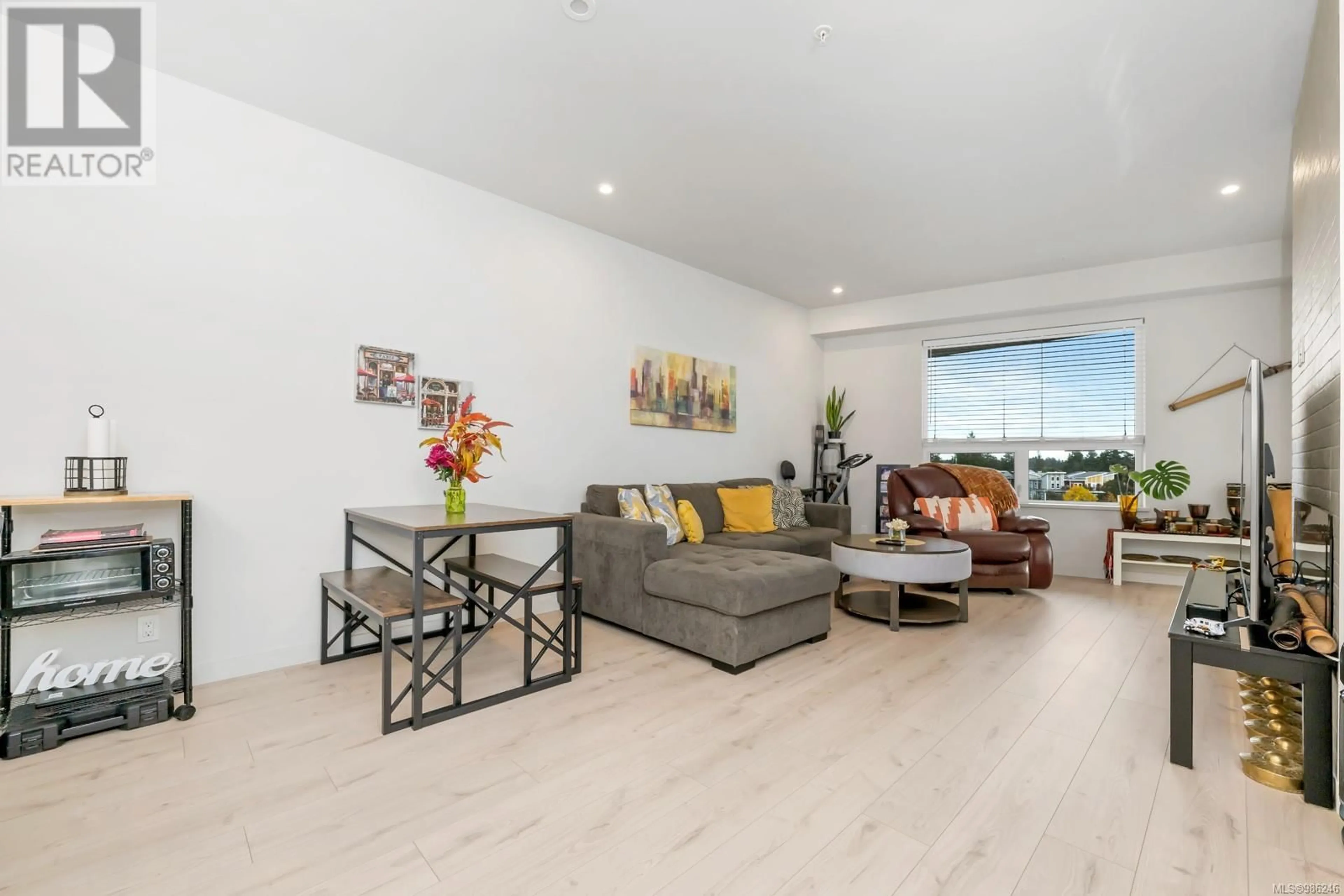 Living room with furniture, wood/laminate floor for 409 958 Pharoah Mews, Langford British Columbia V9B7A1