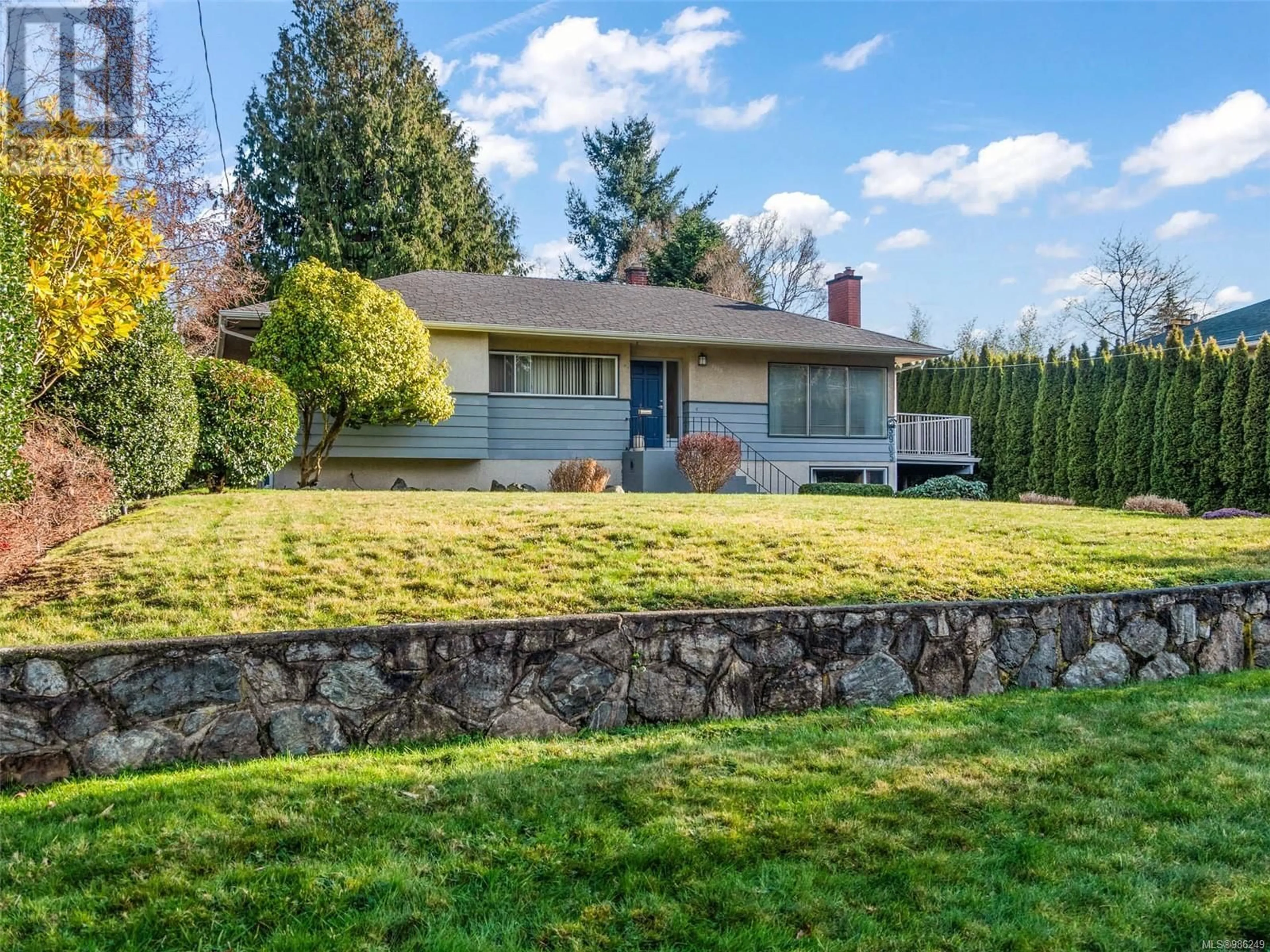 A pic from outside/outdoor area/front of a property/back of a property/a pic from drone, street for 3905 ROWLEY ROAD, Saanich British Columbia V8N4C3