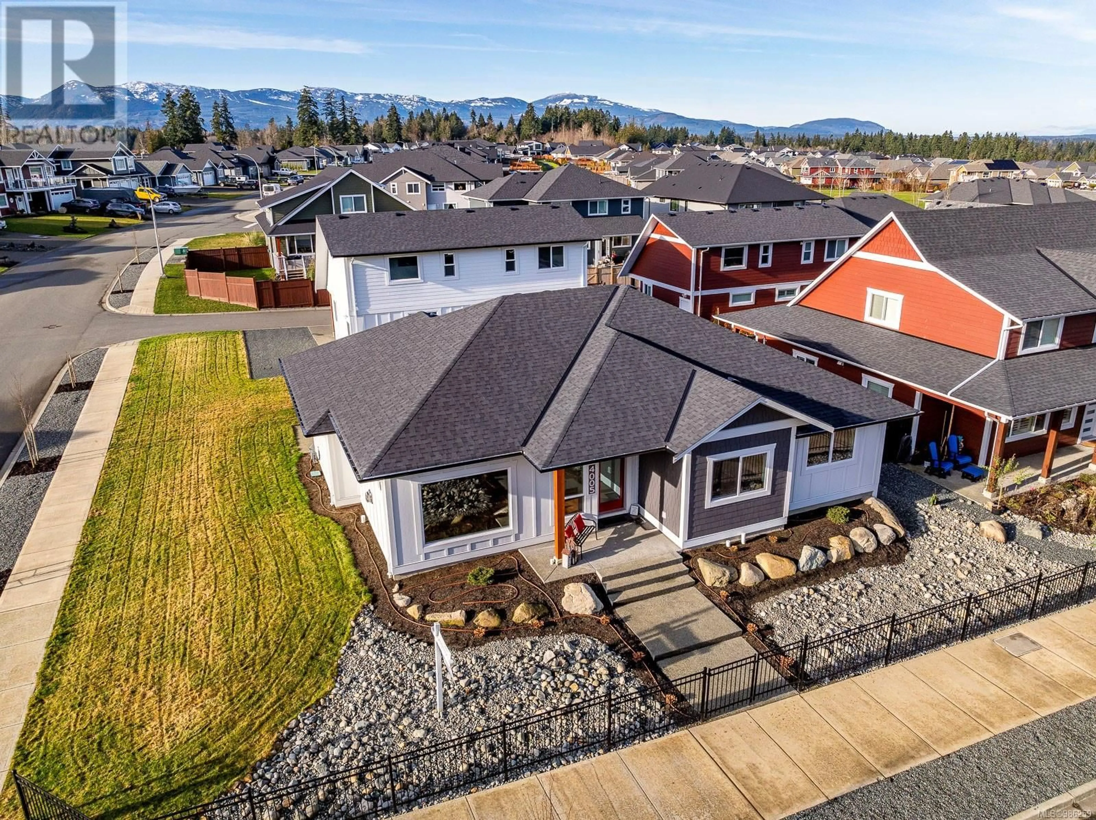 A pic from outside/outdoor area/front of a property/back of a property/a pic from drone, mountain view for 4005 Buckstone Rd, Courtenay British Columbia V9N0B4