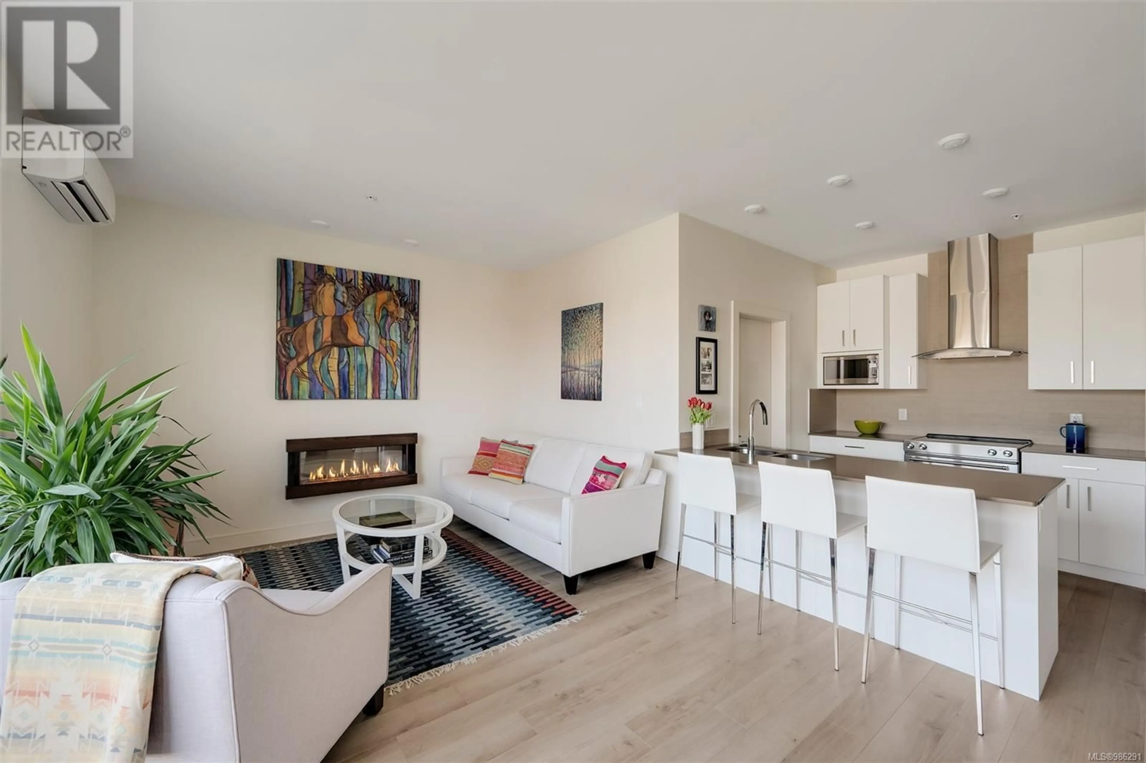 Living room with furniture, wood/laminate floor for 402 300 Michigan St, Victoria British Columbia V8V1R5