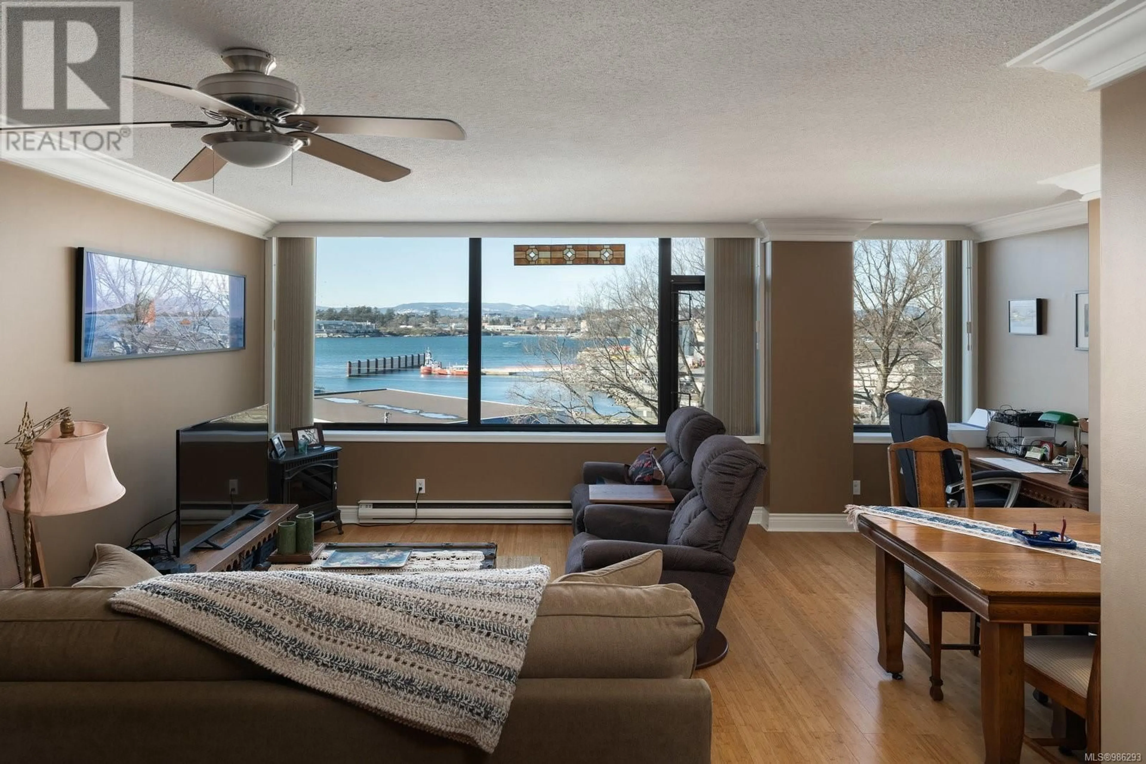 Living room with furniture, wood/laminate floor for 404 104 Dallas Rd, Victoria British Columbia V8V1A3