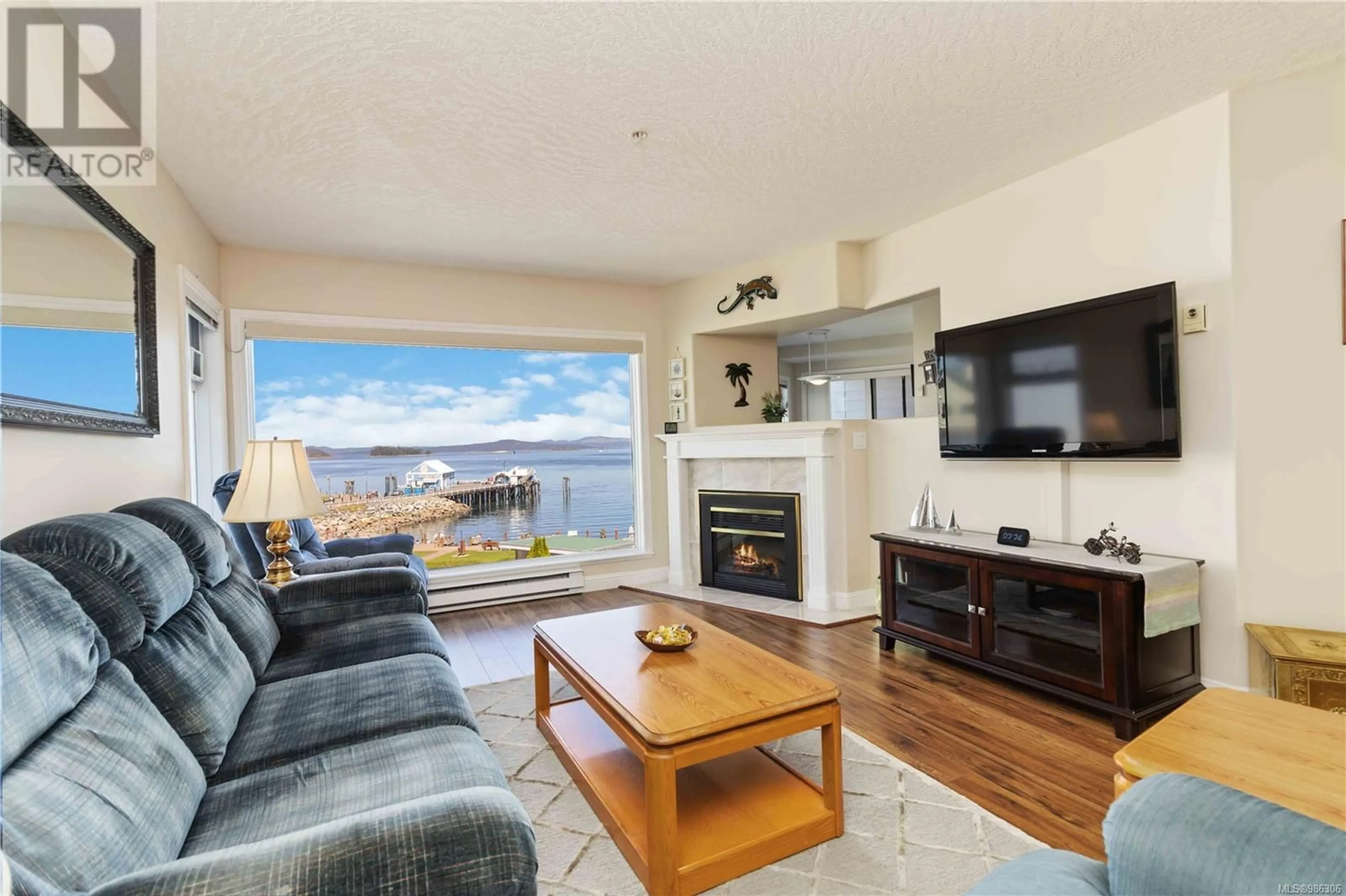 Living room with furniture, wood/laminate floor for 302 2550 Bevan Ave, Sidney British Columbia V8L5Y5