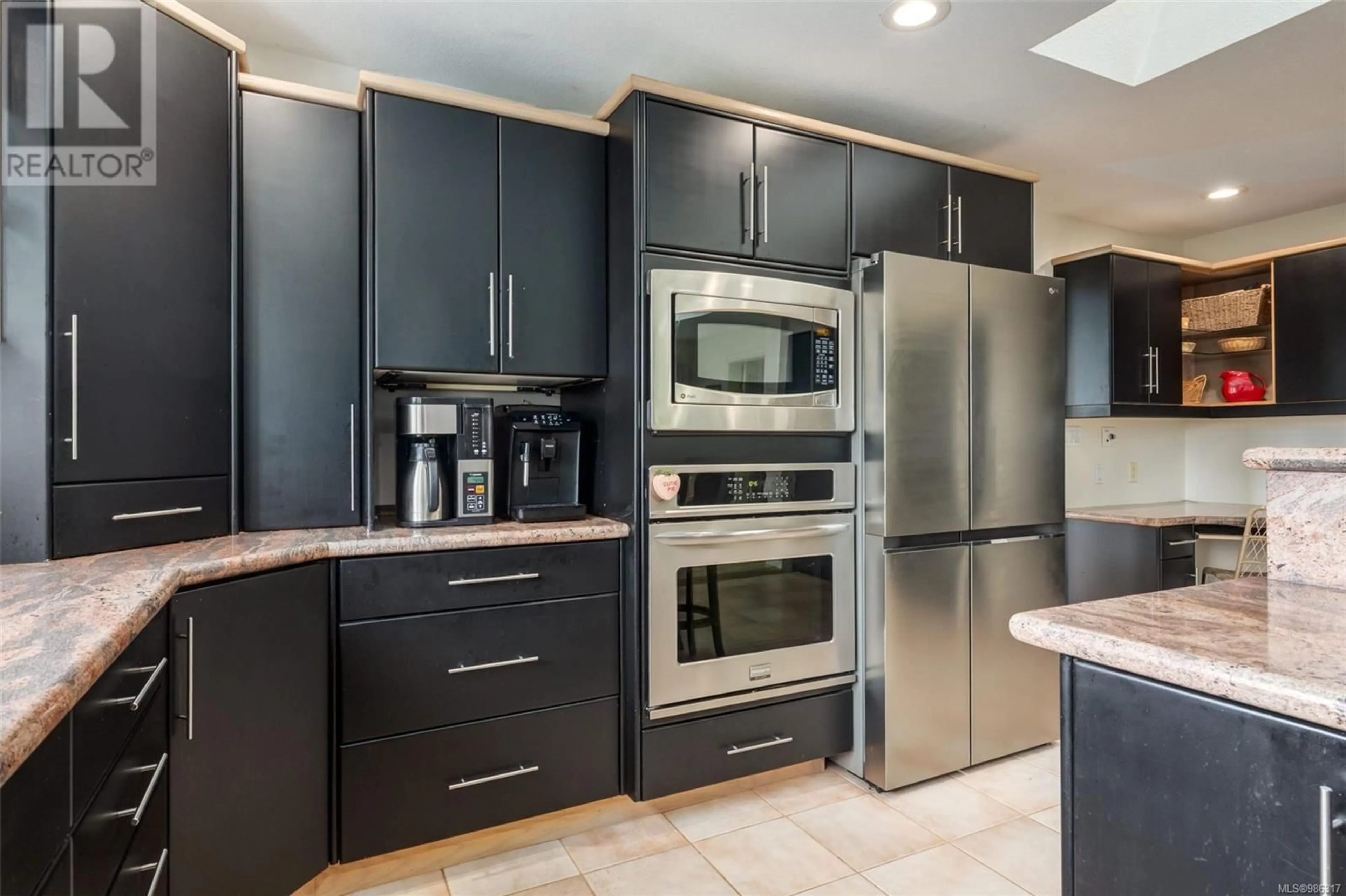 Contemporary kitchen, ceramic/tile floor for 7503 Clark Cres, Lantzville British Columbia V0R2H0