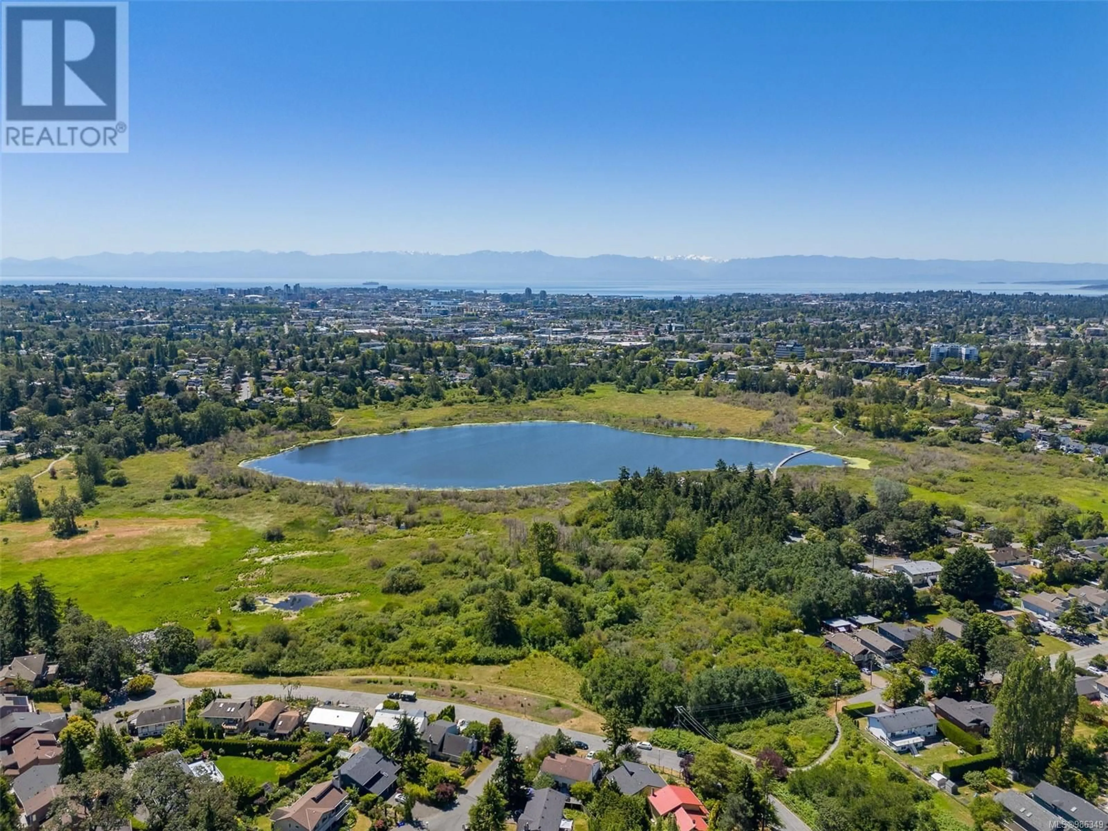 A pic from outside/outdoor area/front of a property/back of a property/a pic from drone, water/lake/river/ocean view for 4020 Travis Pl, Saanich British Columbia V8X4A8