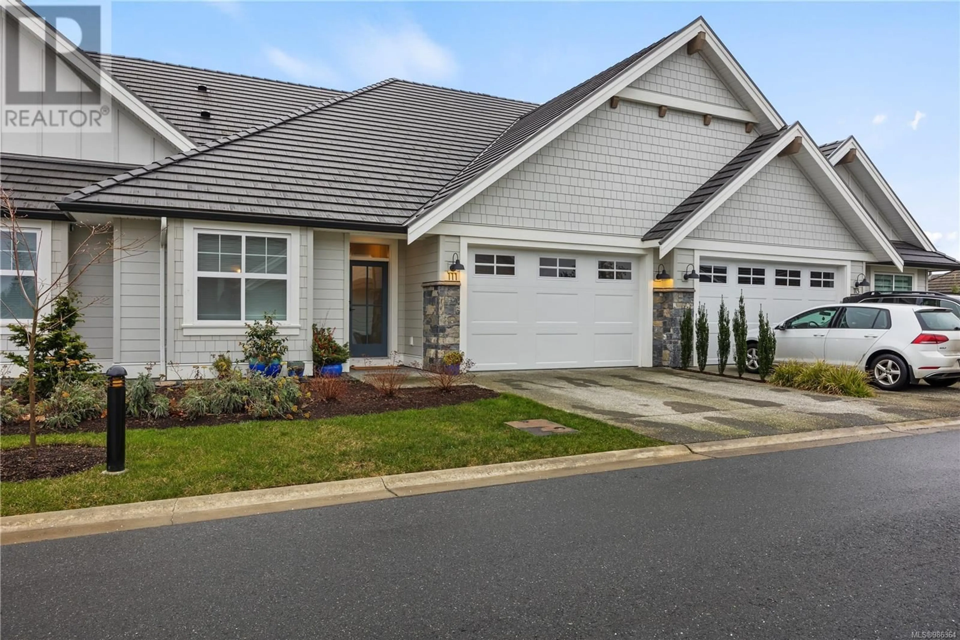 Home with vinyl exterior material, street for 111 1444 Crown Isle Dr, Courtenay British Columbia V9N0B8