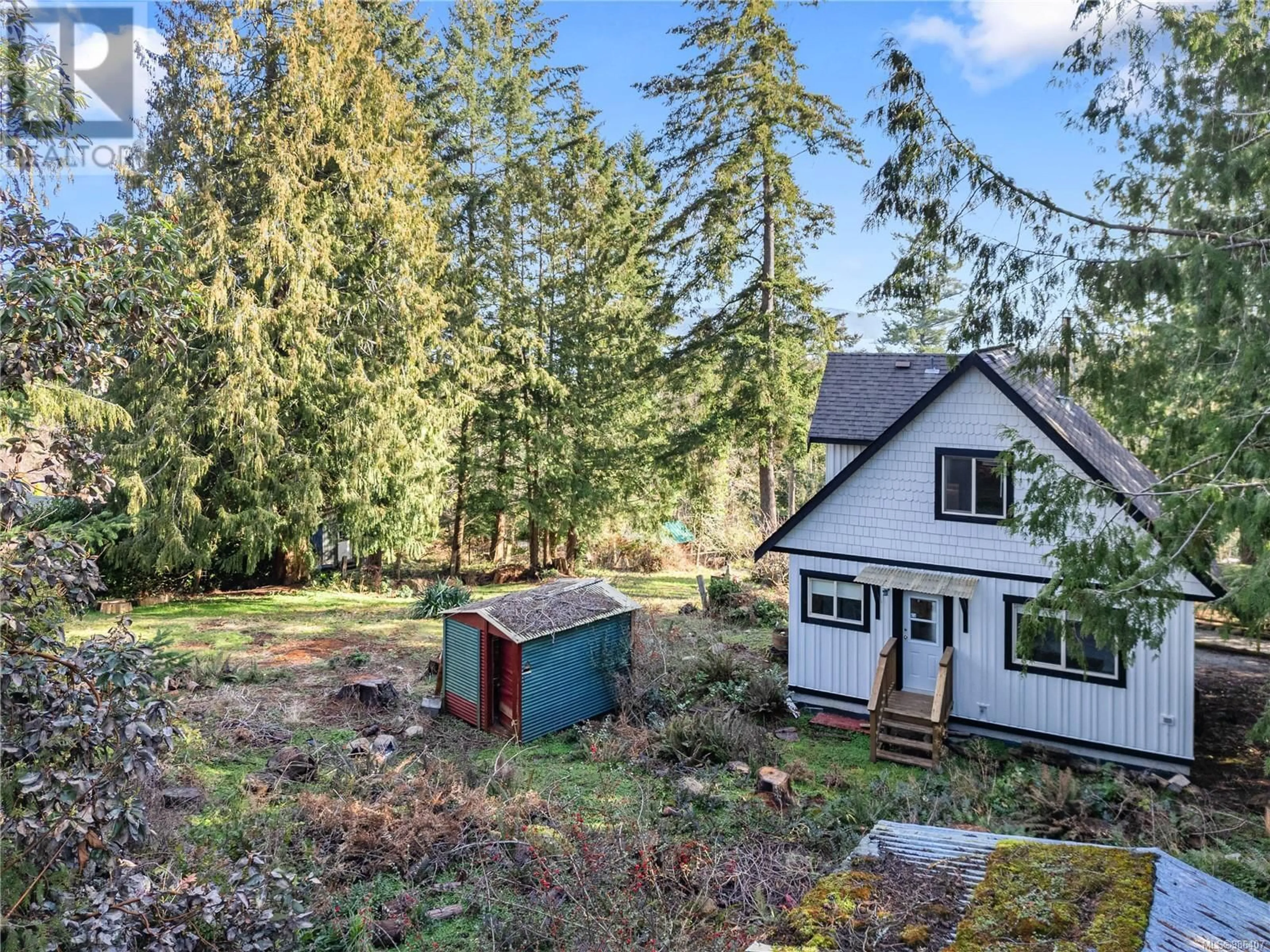 A pic from outside/outdoor area/front of a property/back of a property/a pic from drone, forest/trees view for 150 Main St, Salt Spring British Columbia V8K1P2