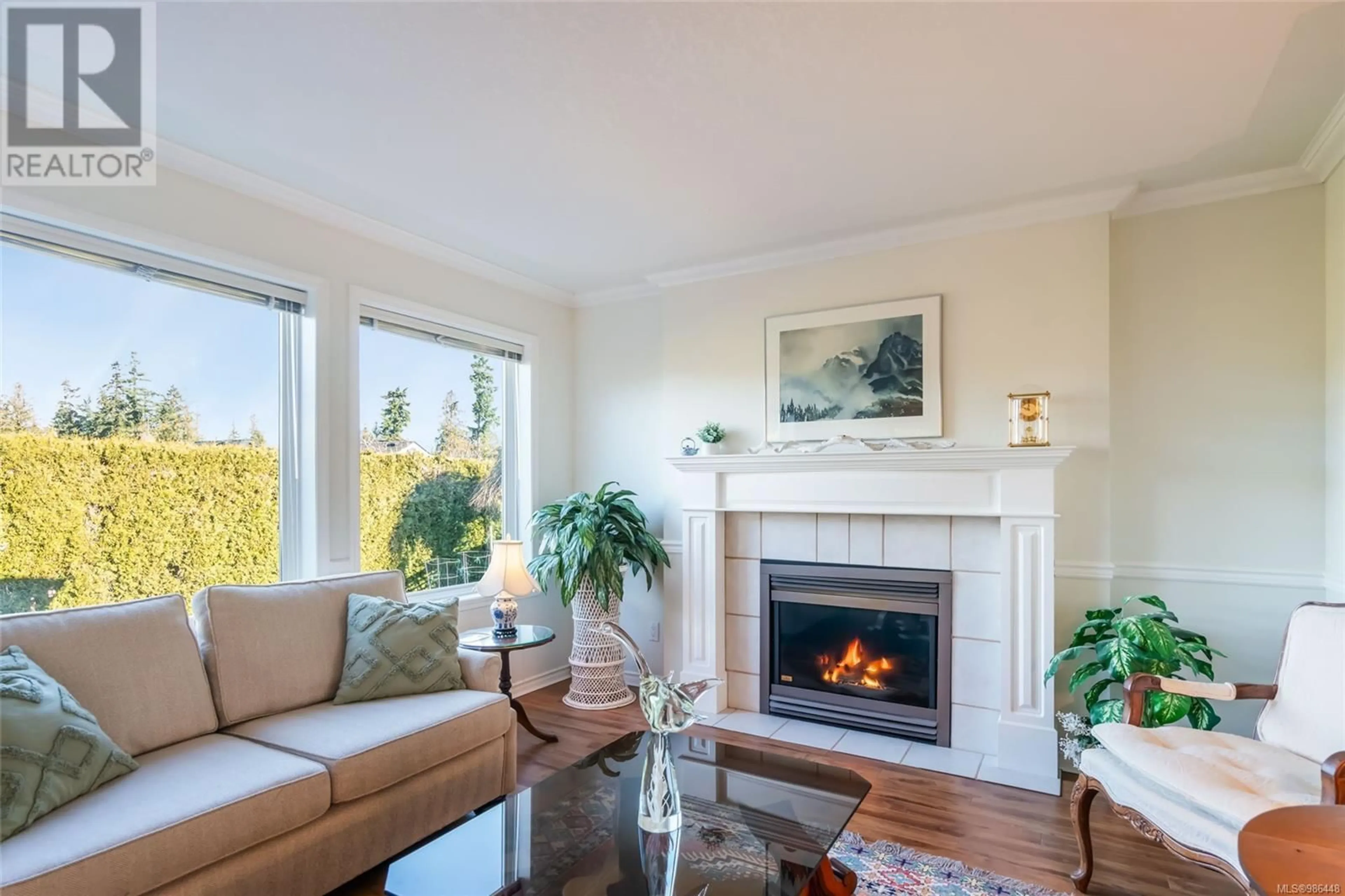 Living room with furniture, wood/laminate floor for 1291 Leeward Way, Qualicum Beach British Columbia V9K2M1