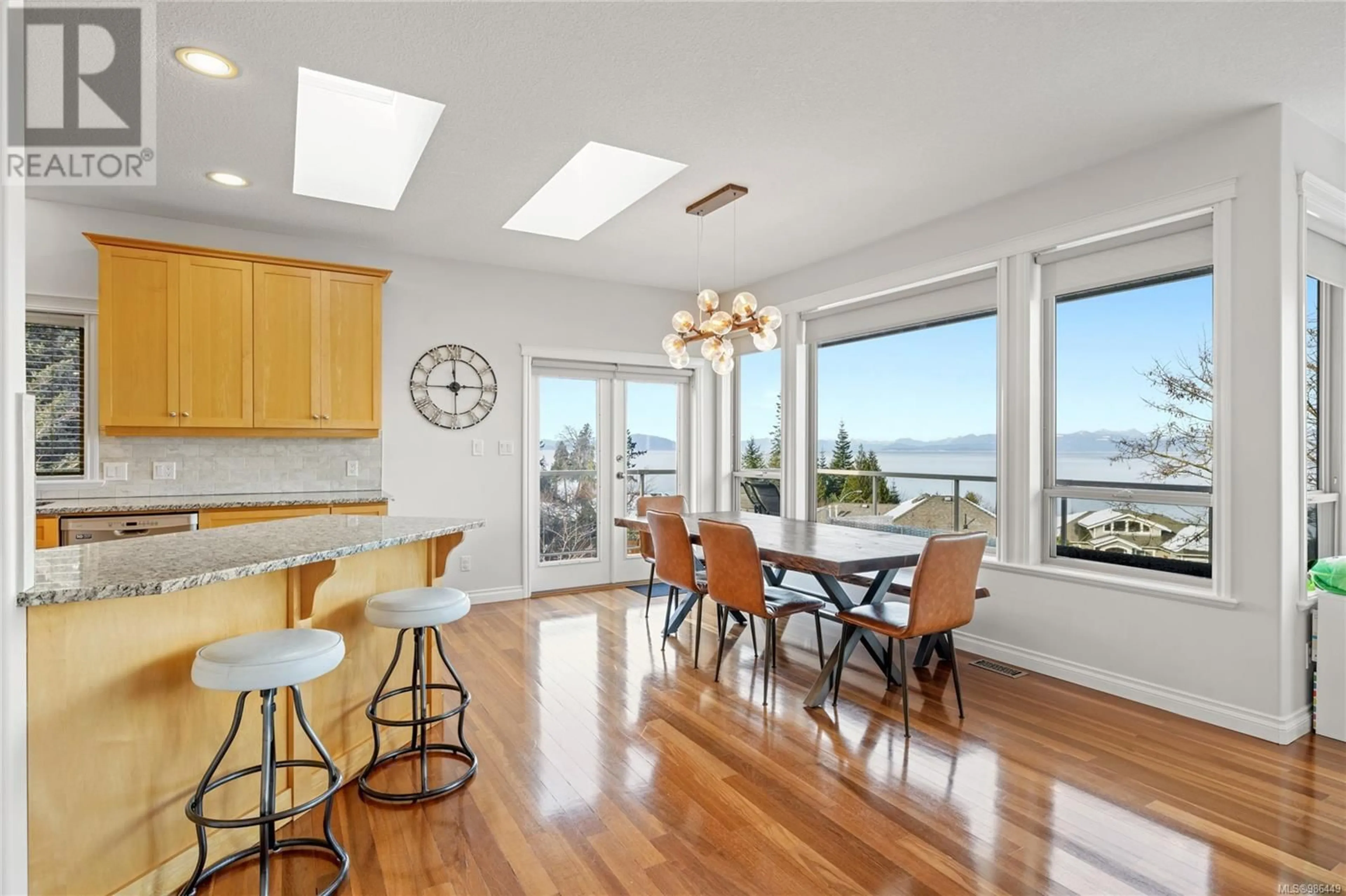 Open concept kitchen, wood/laminate floor for 5684 MUGGIES WAY, Nanaimo British Columbia V9V1W2