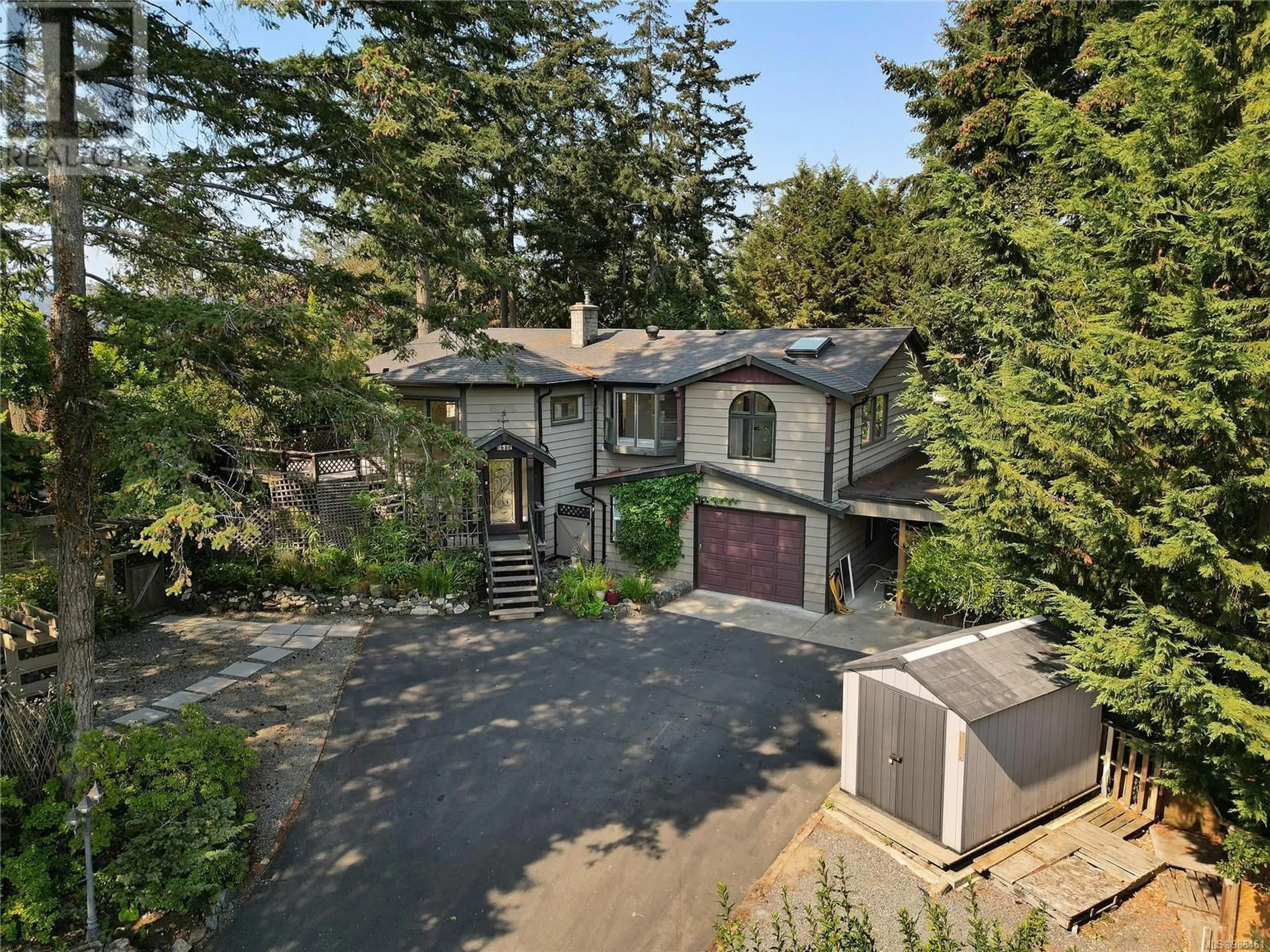 A pic from outside/outdoor area/front of a property/back of a property/a pic from drone, street for 2582 Rainville Rd, Langford British Columbia V9B3N1