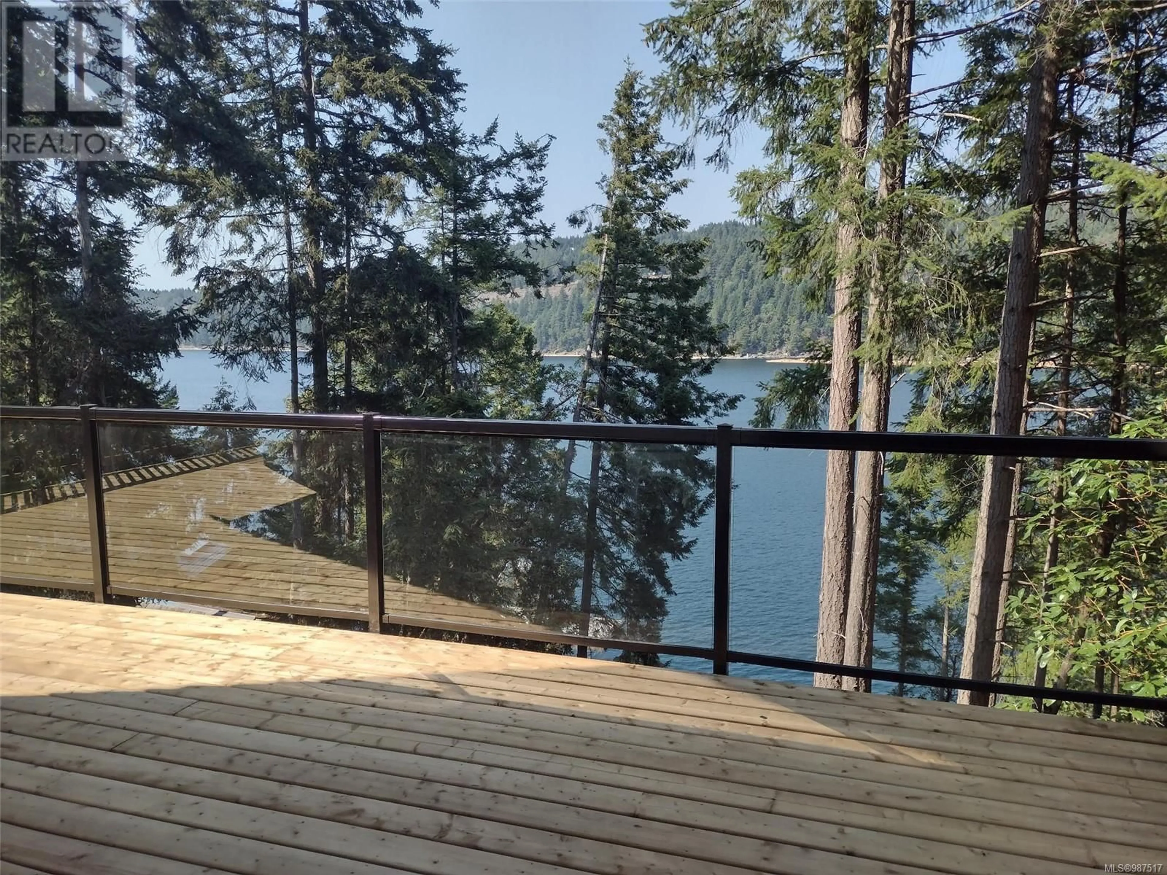 A pic from outside/outdoor area/front of a property/back of a property/a pic from drone, forest/trees view for 288 COHO BOULEVARD, Mudge Island British Columbia V0R1X6