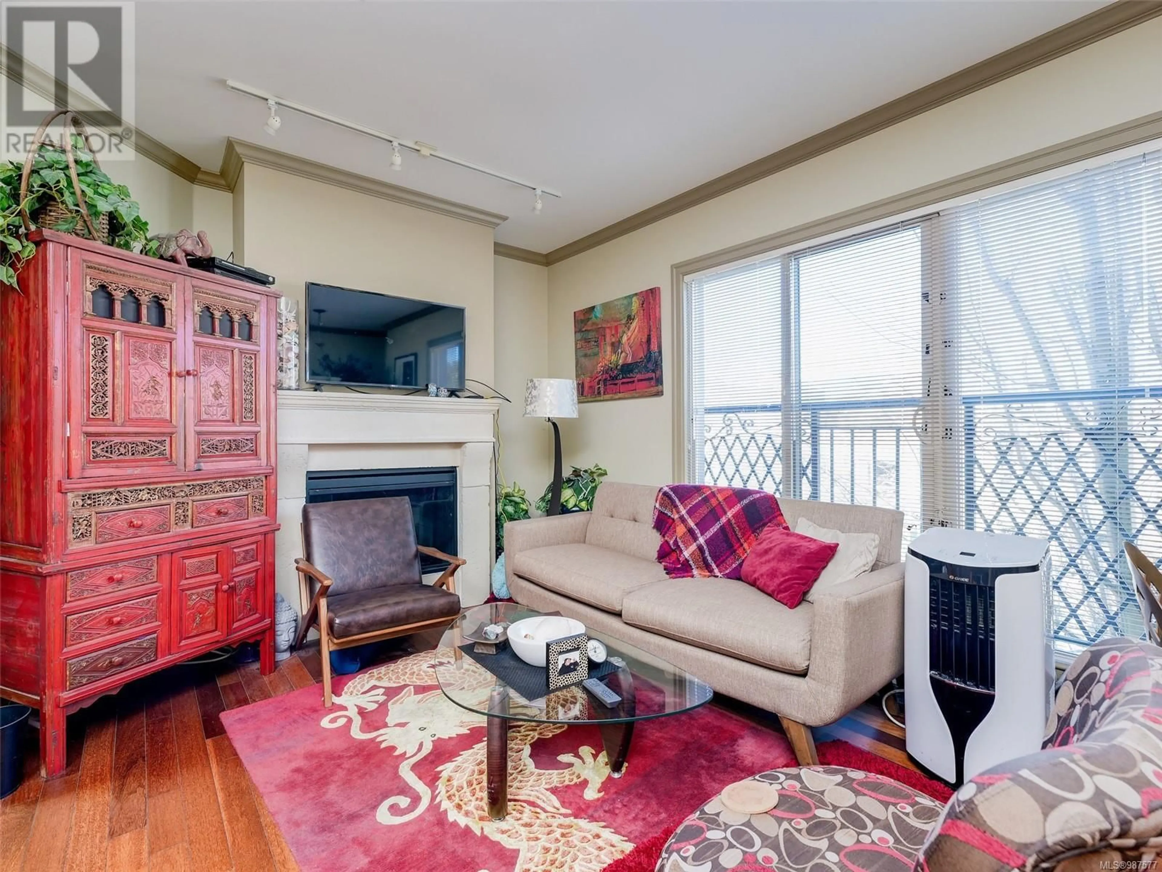 Living room with furniture, wood/laminate floor for 303 1642 McKenzie Ave, Saanich British Columbia V8N0A3