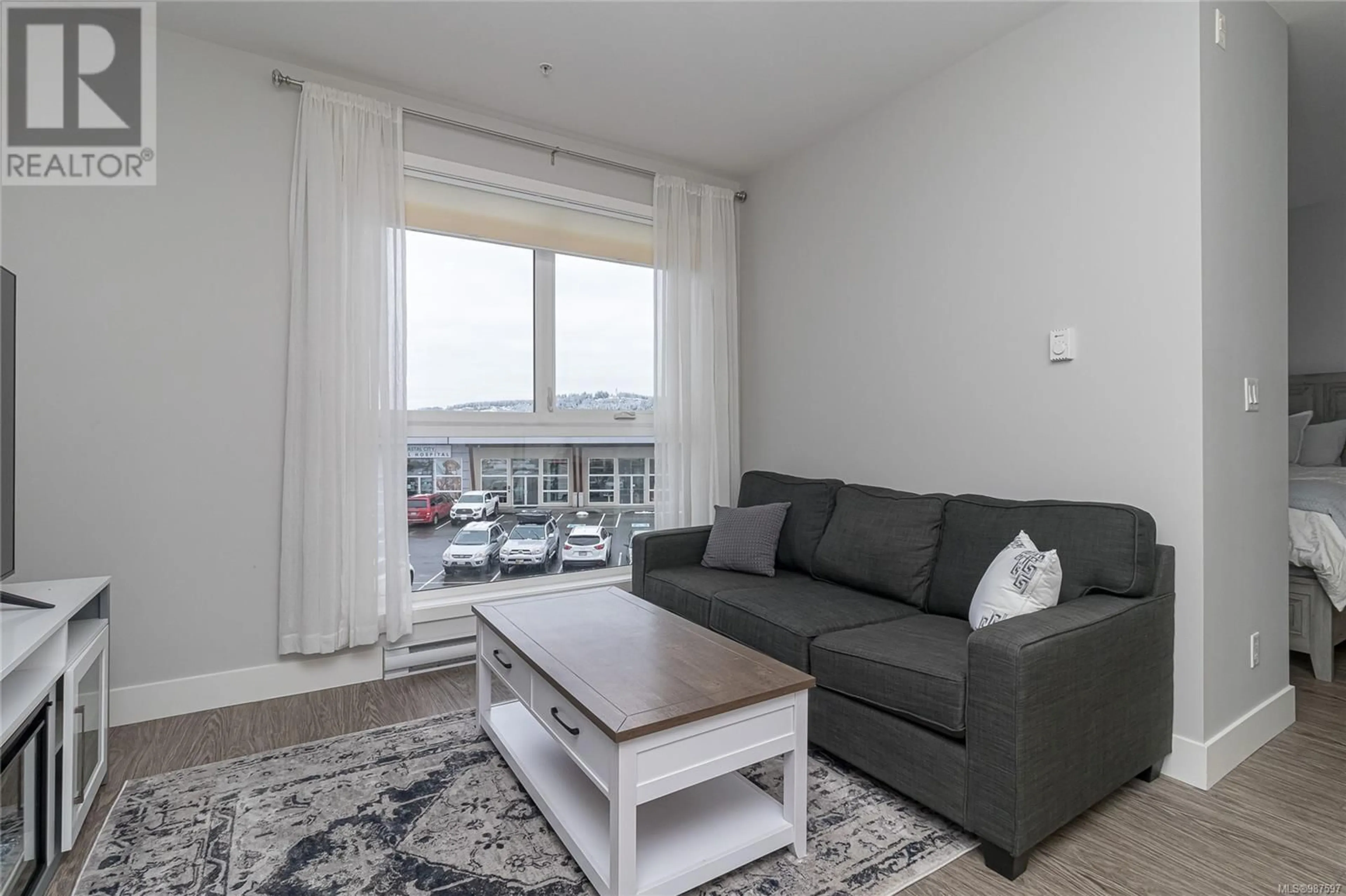 Living room with furniture, unknown for 205 1847 Dufferin Cres, Nanaimo British Columbia V9S0B1