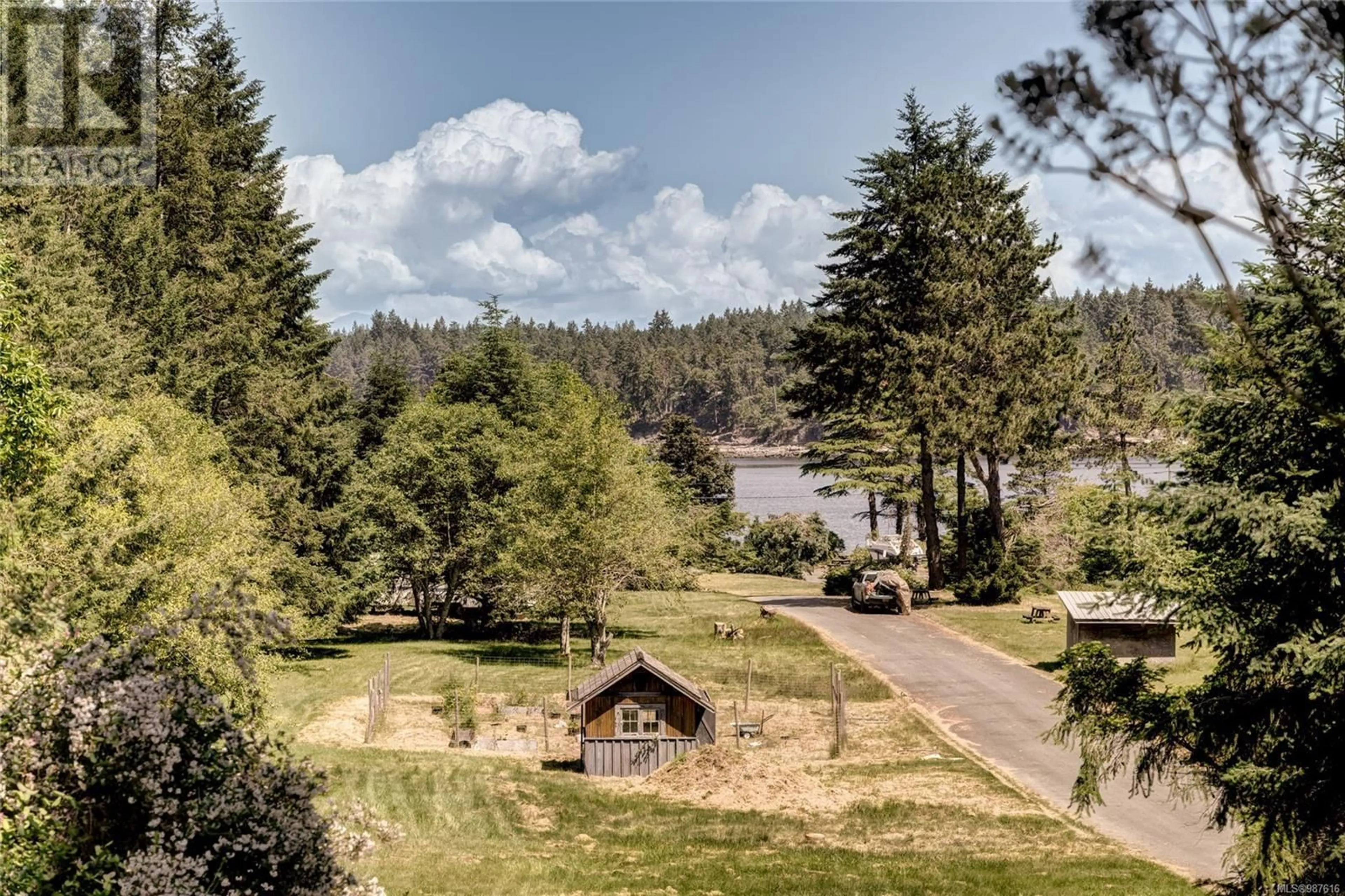 A pic from outside/outdoor area/front of a property/back of a property/a pic from drone, forest/trees view for 215 Easthom Rd, Gabriola Island British Columbia V0R1X2