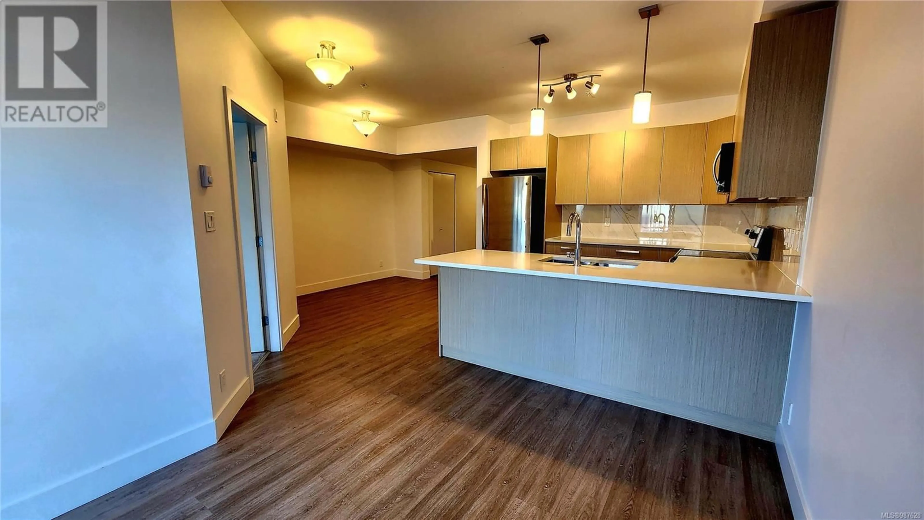 Open concept kitchen, wood/laminate floor for 110 3070 Kilpatrick Ave, Courtenay British Columbia V9N0G7