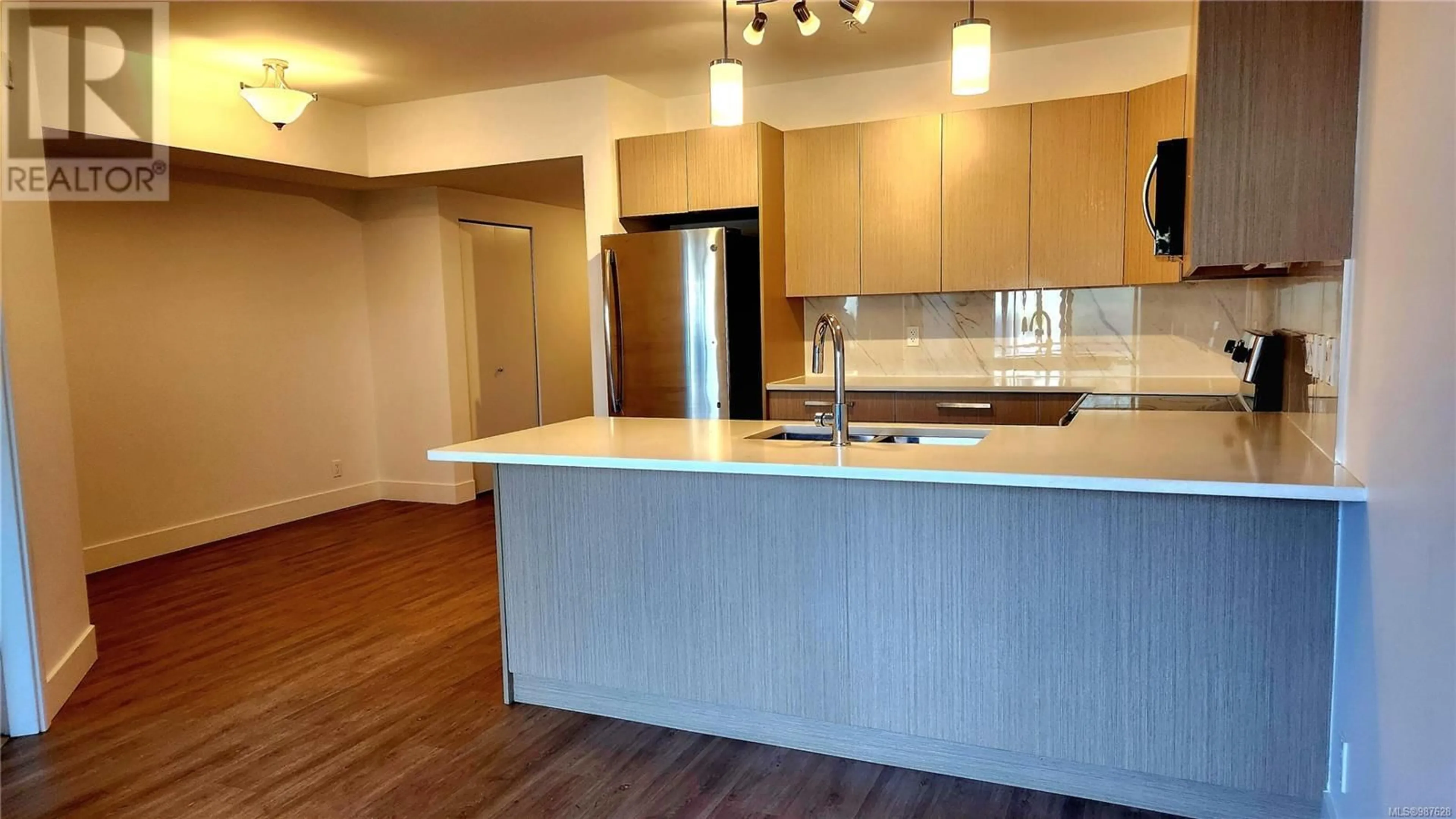 Open concept kitchen, wood/laminate floor for 110 3070 Kilpatrick Ave, Courtenay British Columbia V9N0G7